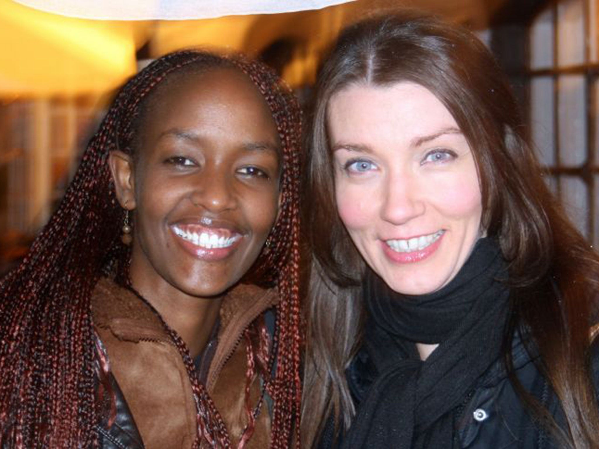 Happier times: Vicky Walker,right, with her friend Linah Keza, who had relocated to England from her former home of Rwanda