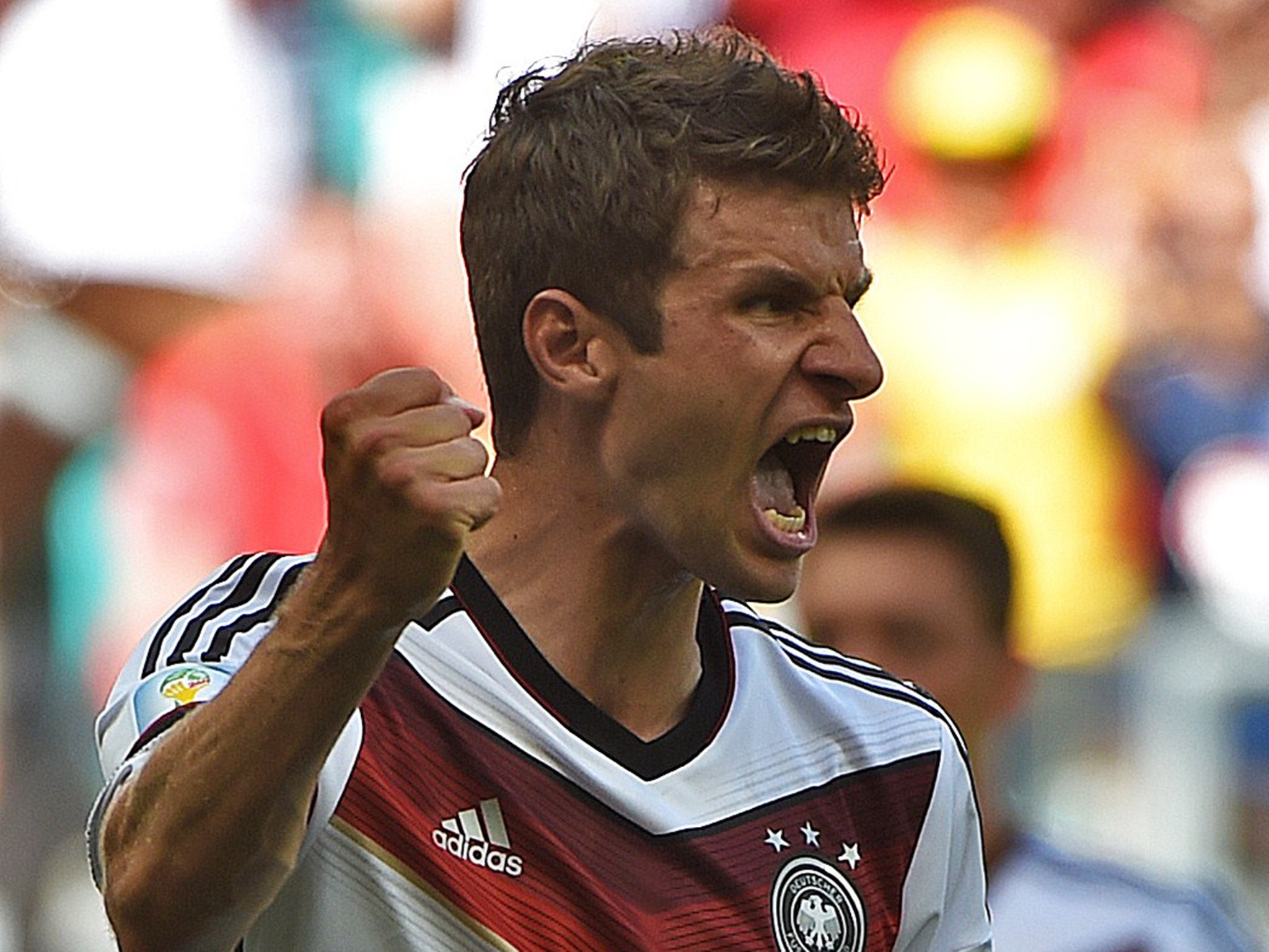 Thomas Mueller celebrates on his way to a hat-trick
