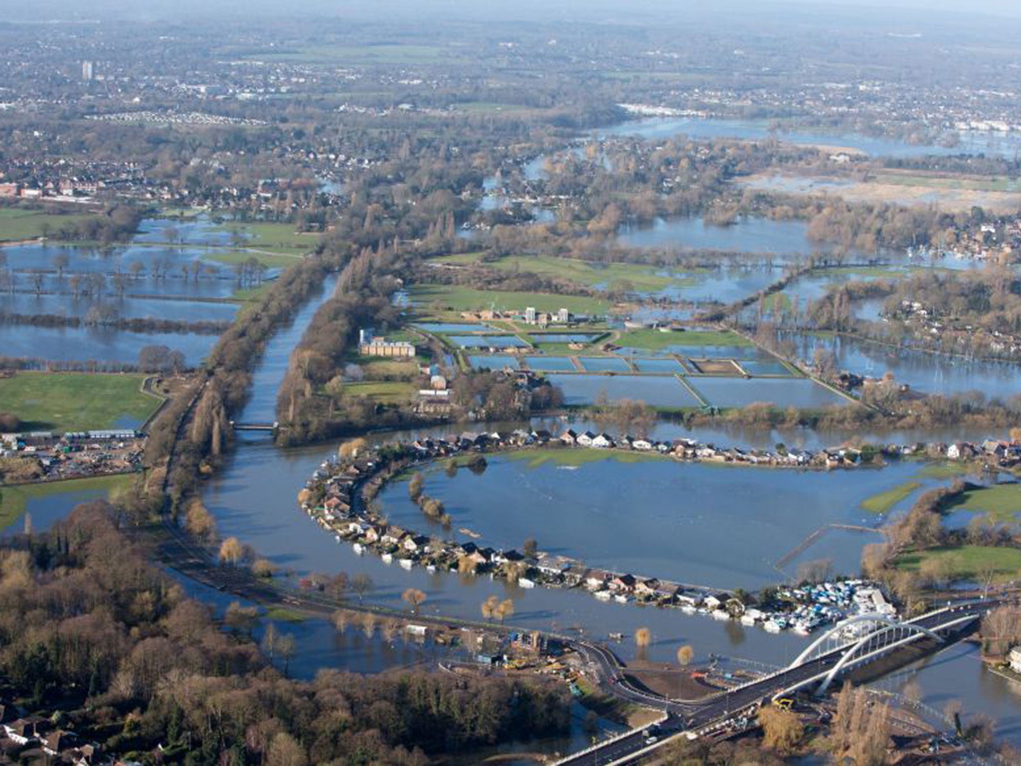 MPs argued maintaining flood protection for vulnerable communities such as Walton-on-Thames, pictured, should take priority over cost-cutting