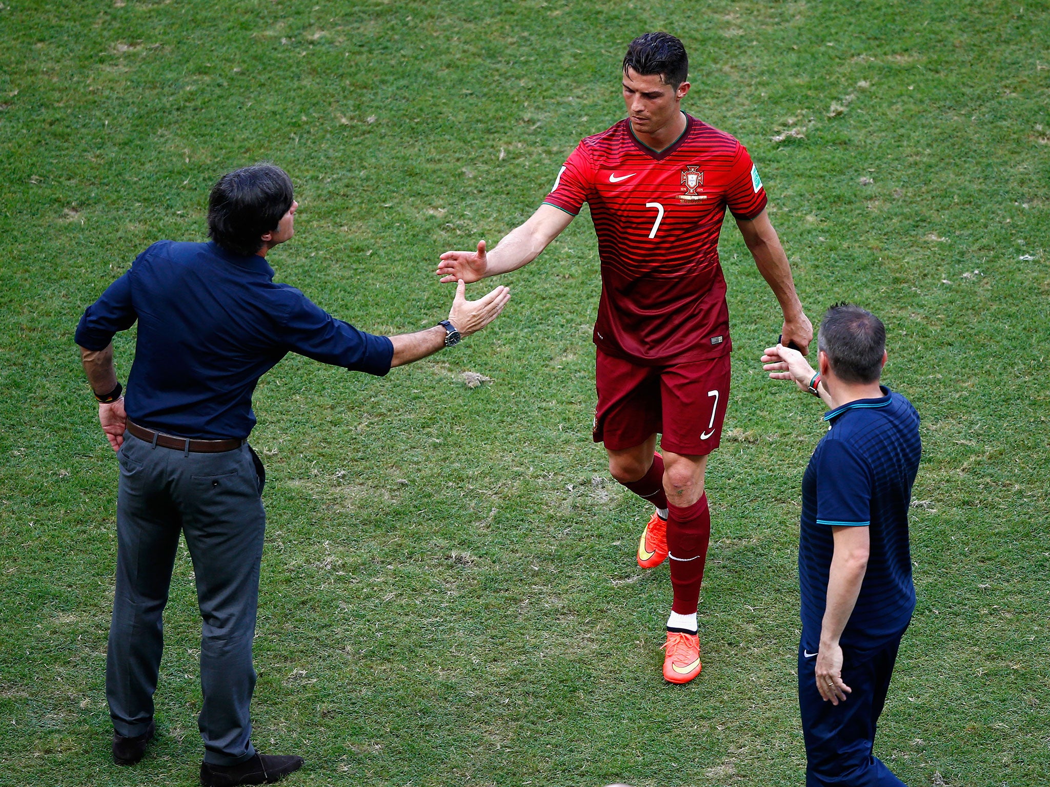 Cristiano Ronaldo shakes Joachim Low's hand. If only he knew what had happened seconds before