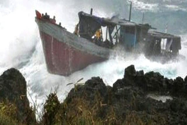 The boat laden with refugees hits the rocks at Christmas Island in 2010