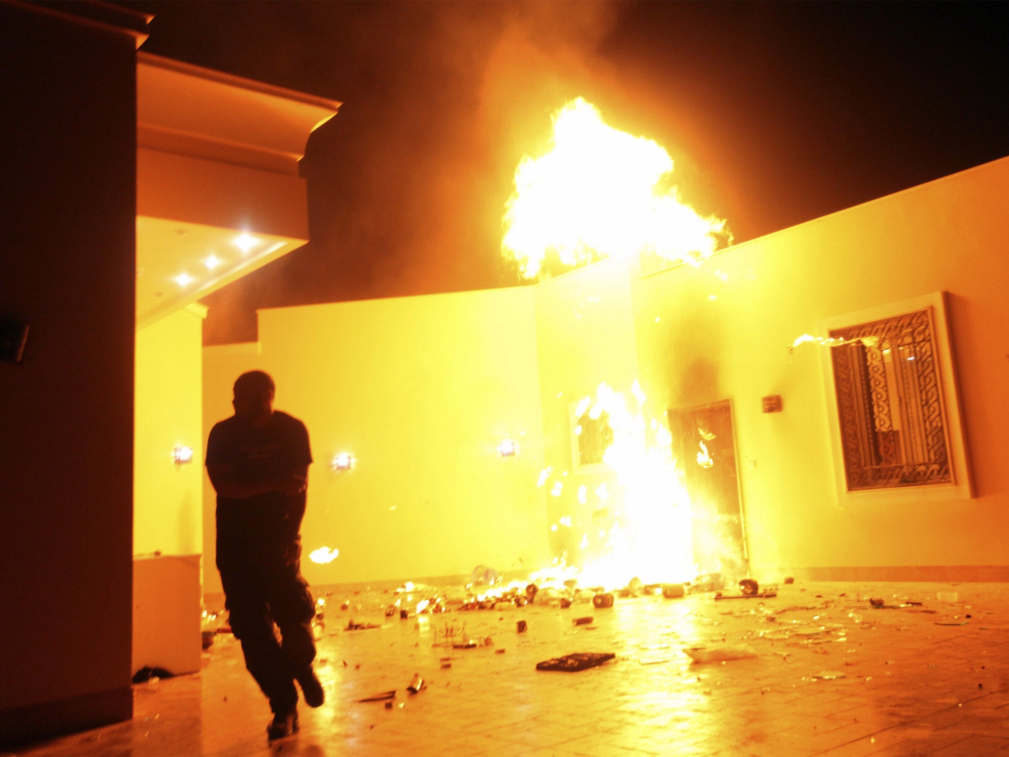 The American compound in Benghazi is seen in flames after the 2012 terrorist attack