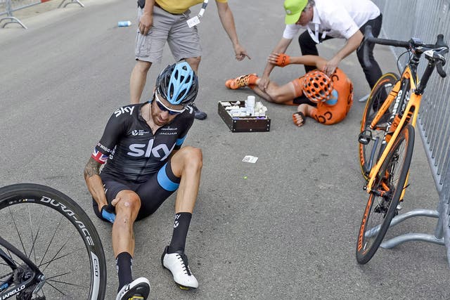 Bradley Wiggins crashed with 26 kilometres remaining and now lies 14 minutes adrift of leader Tony Martin in the Tour of Switzerland