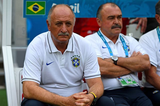 Head coach Luiz Felipe Scolari of Brazil looks on during the 2014 FIFA World Cup Brazil Group A match between Brazil and Mexico at Castelao