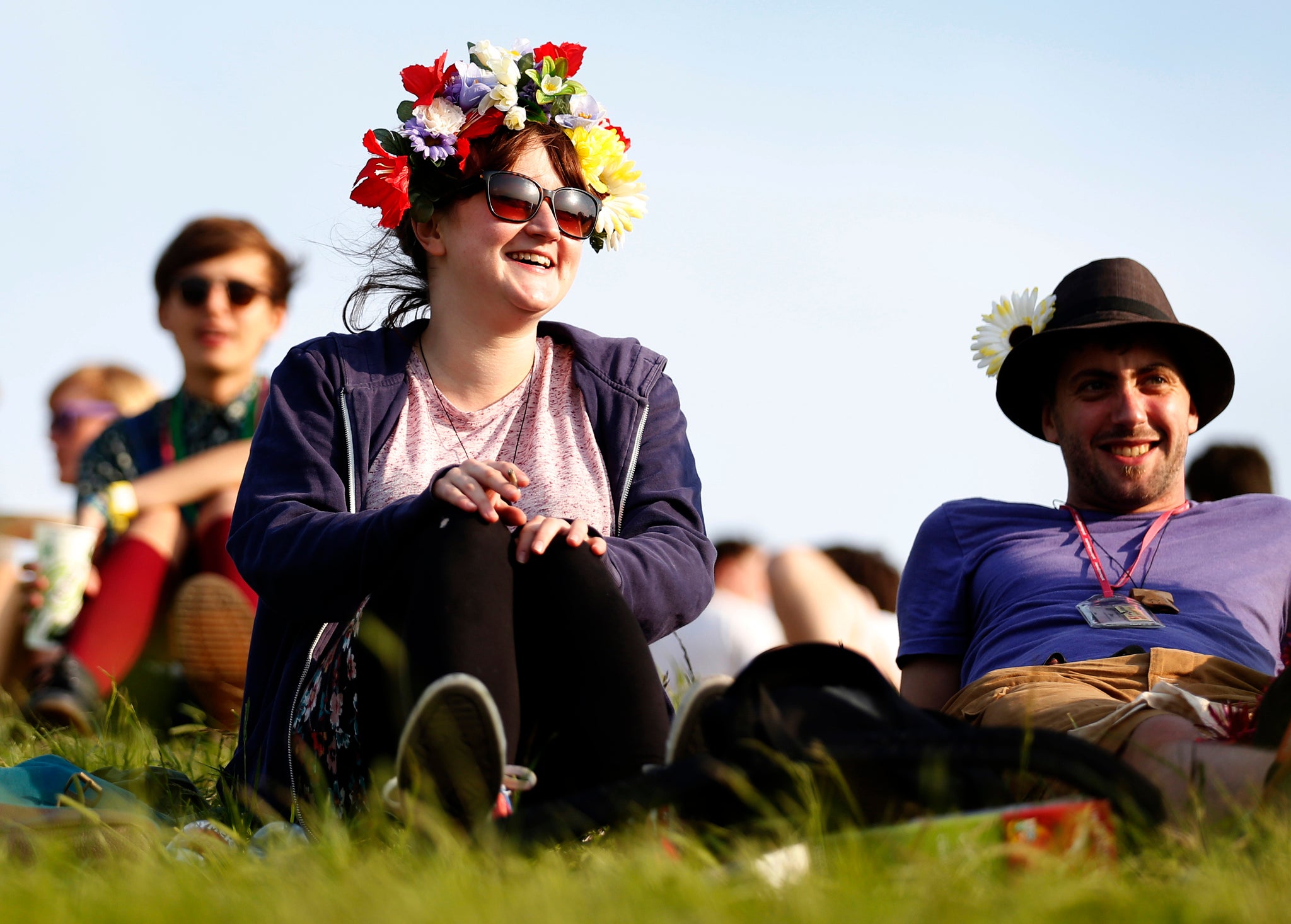 Festivalgoers relax in the sunshine during last year's Glastonbury