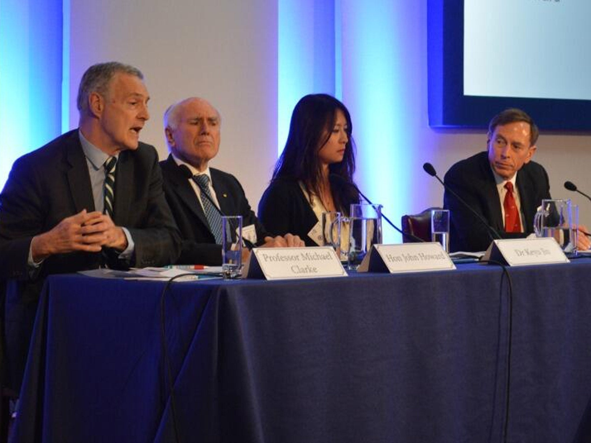 (From left) Conference chairman Michael Clarke, John Howard, Dr Keyu Jin and General David Petraeus