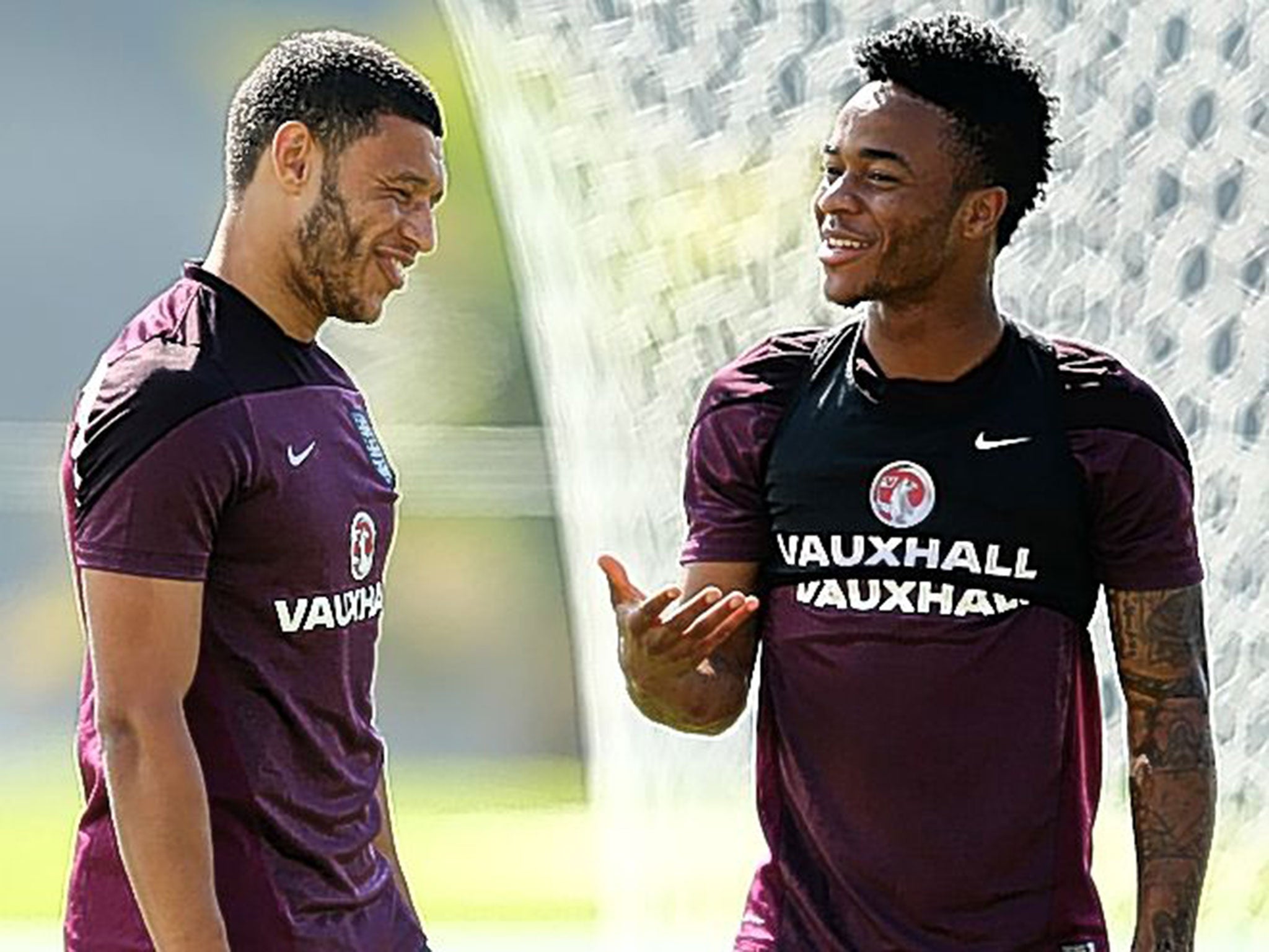 Raheem Sterling (right) shares a joke with Alex Oxlade-Chamberlain during an England training session