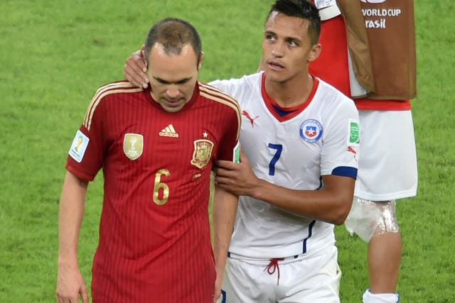 Alexis Sanchez (right) consoles his club-mate from Barcelona Andres Iniesta