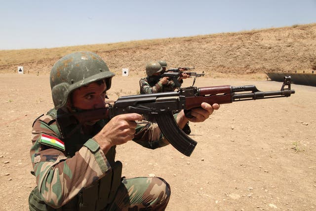 Members of the Kurdish security forces in northern Iraq, as a Kurdish intelligence chief warned that 'up to 450' British nationals are now fighting with Isis