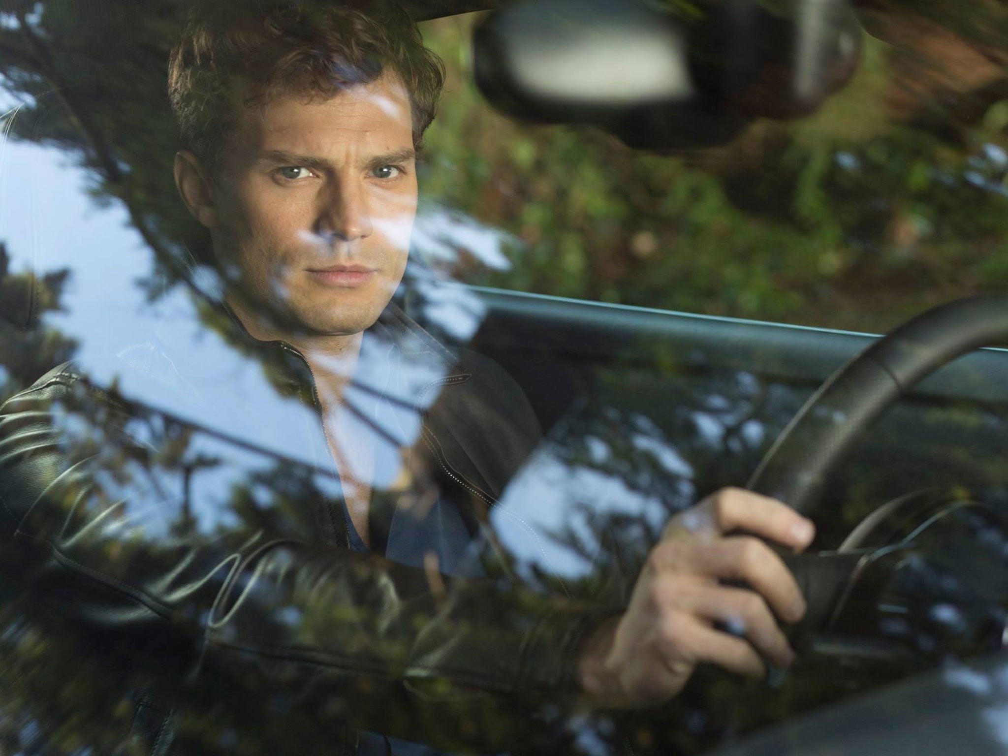 Jamie Dornan as Christian Grey in the first-look Fifty Shades of Grey movie still