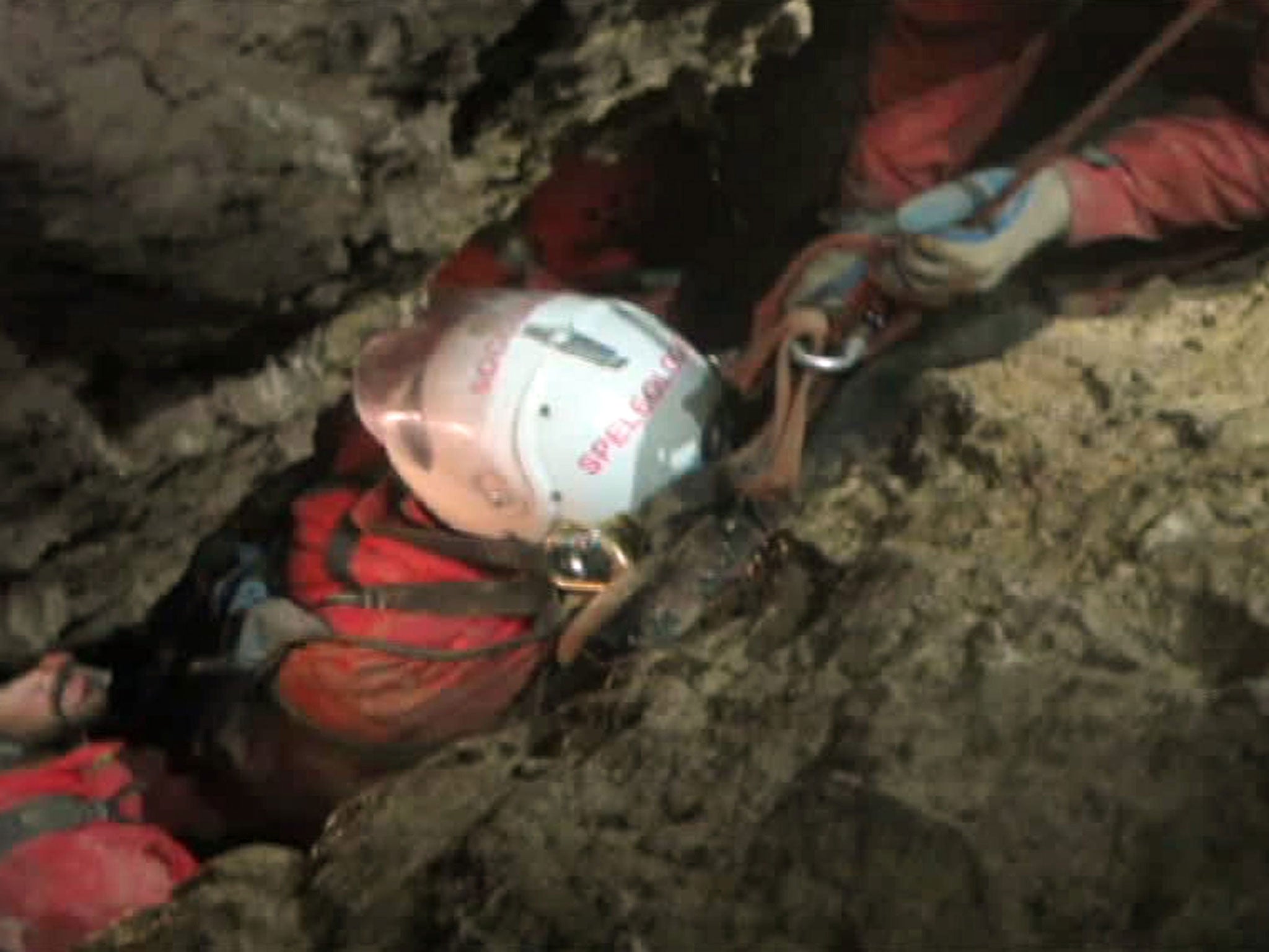 A screenshot from a video made available on 17 June by the Bavarian Mountain Rescue showing injured cave explorer Johann Westhauser being transported through the Riesending cave