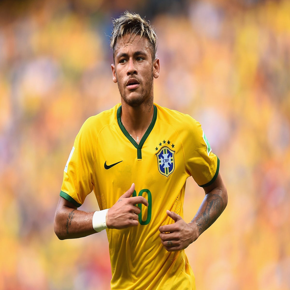 Brazilian football star Neymar, or Neymar Jr., poses as he arrives