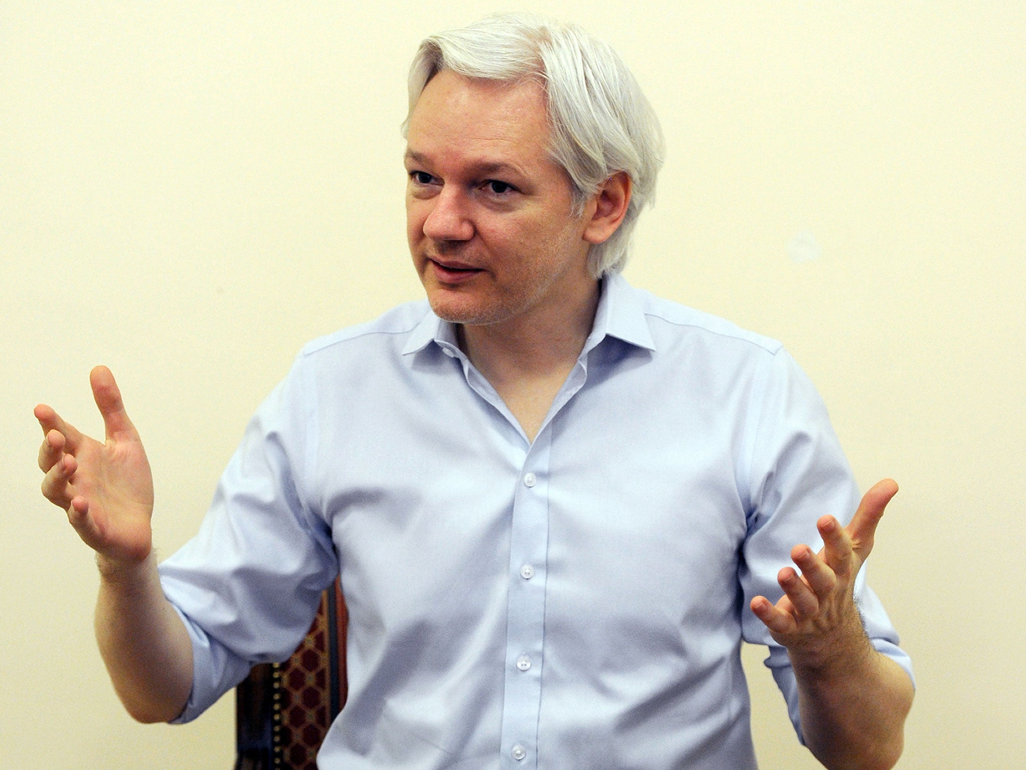 Wikileaks founder Julian Assange speaks to the media inside the Ecuadorian Embassy in London on 14 June, 2013, ahead of the first anniversary of his arrival there on 19 June, 2012