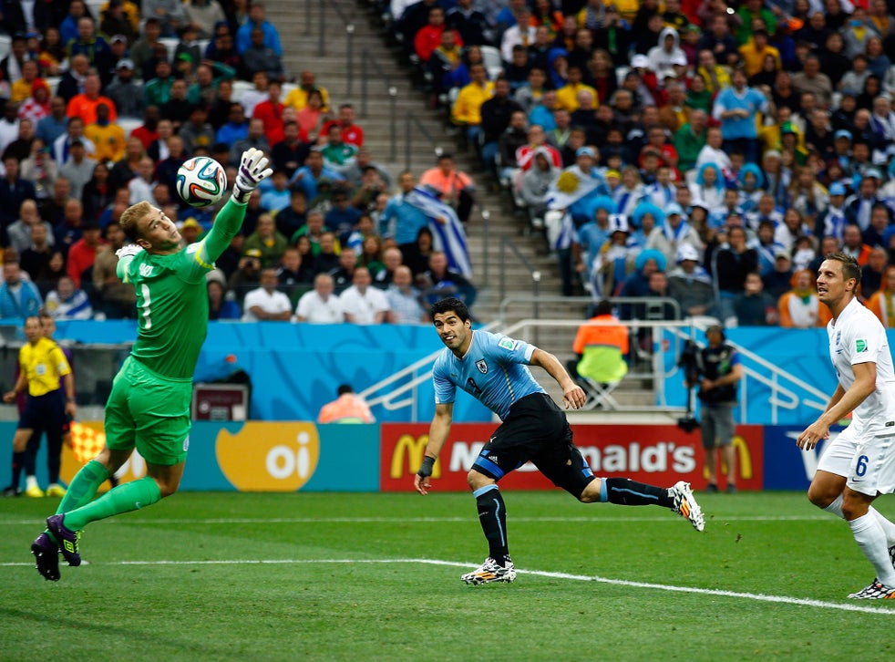 Luis Suarez bites Italian defender at the World Cup 