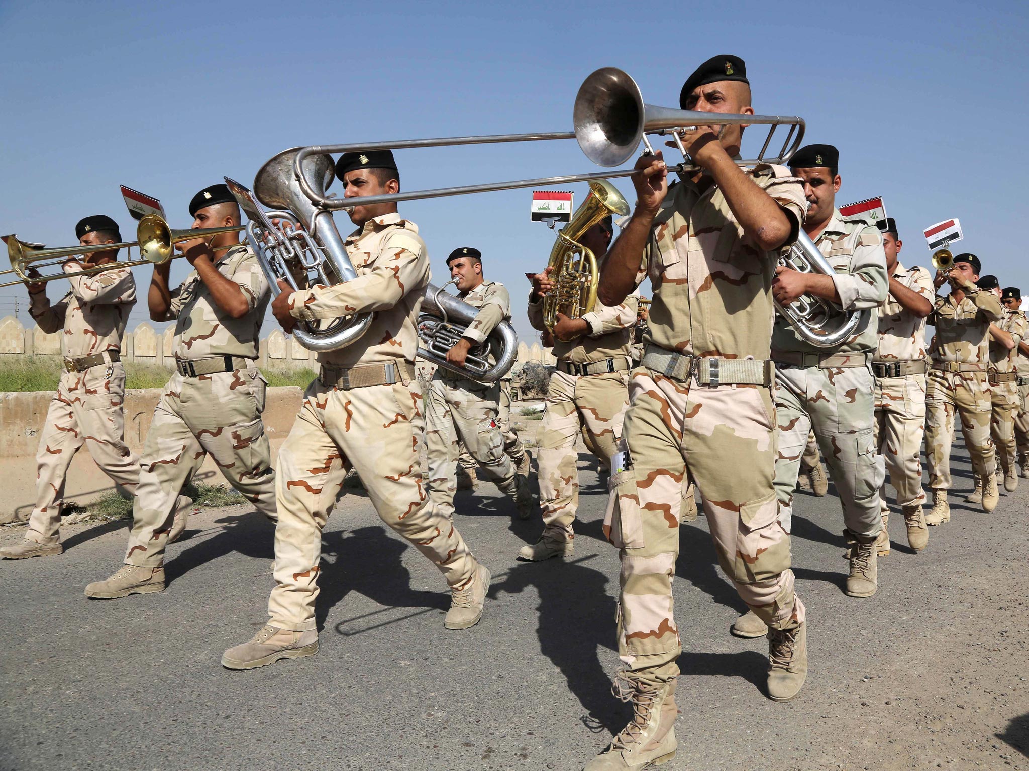 A recruiting drive in Baghdad yesterday. While state media emphasises patriotism, Isis is dominating on Twitter