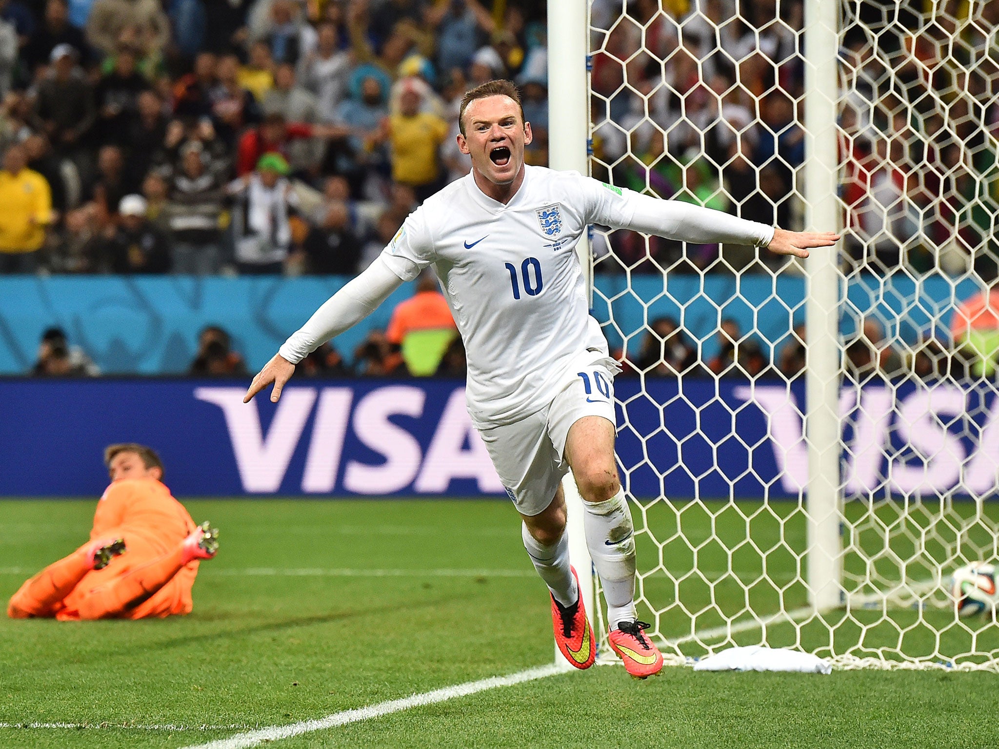 Wayne Rooney wheels away in celebration after scoring his first World Cup goal