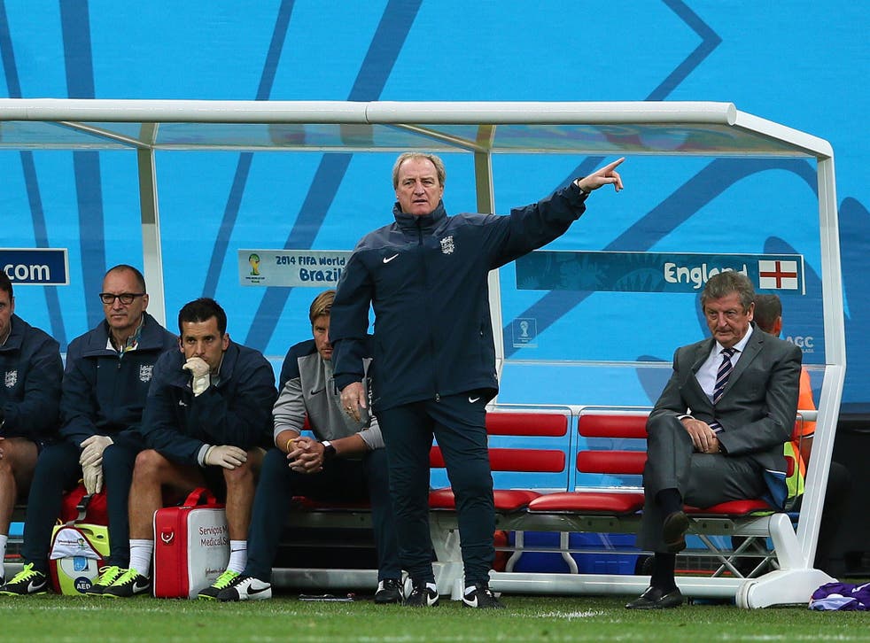 Roy Hodgson sits in the dugout during the Uruguay game