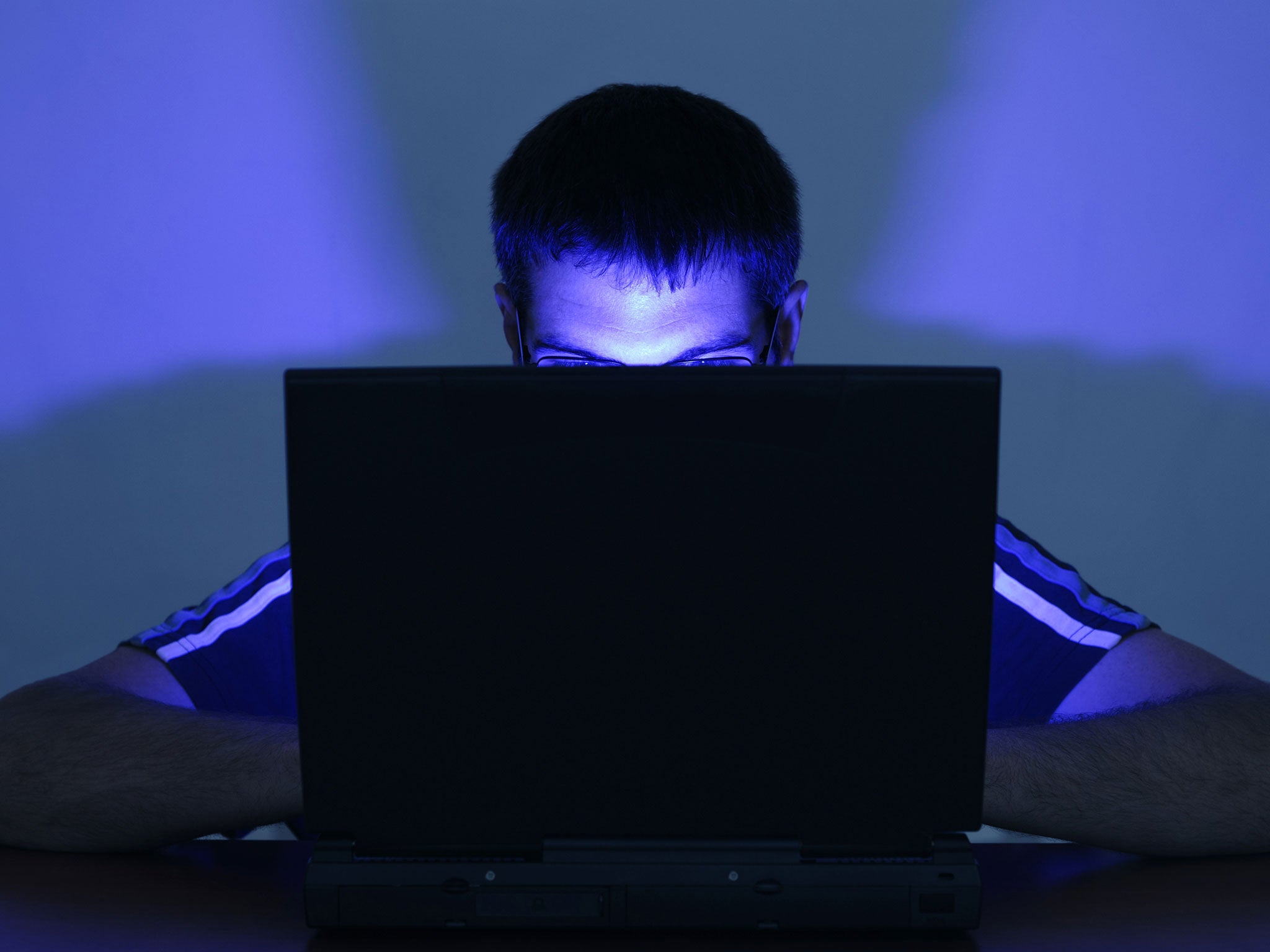 A man uses a laptop