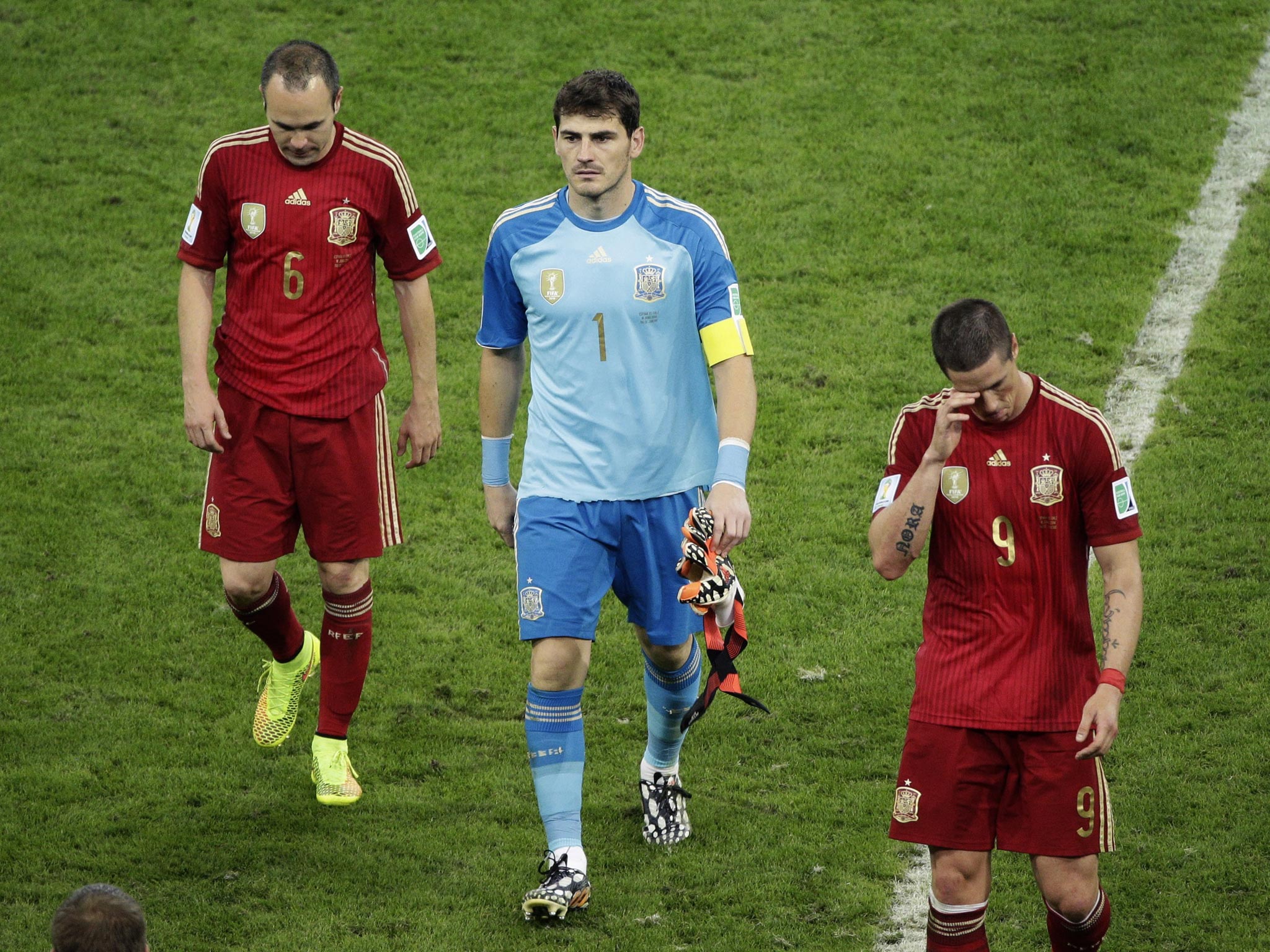 From left; Spain’s Andres Iniesta, goalkeeper Iker
Casillas and Fernando Torres trudge off the pitch at the
Maracana on Wednesday night