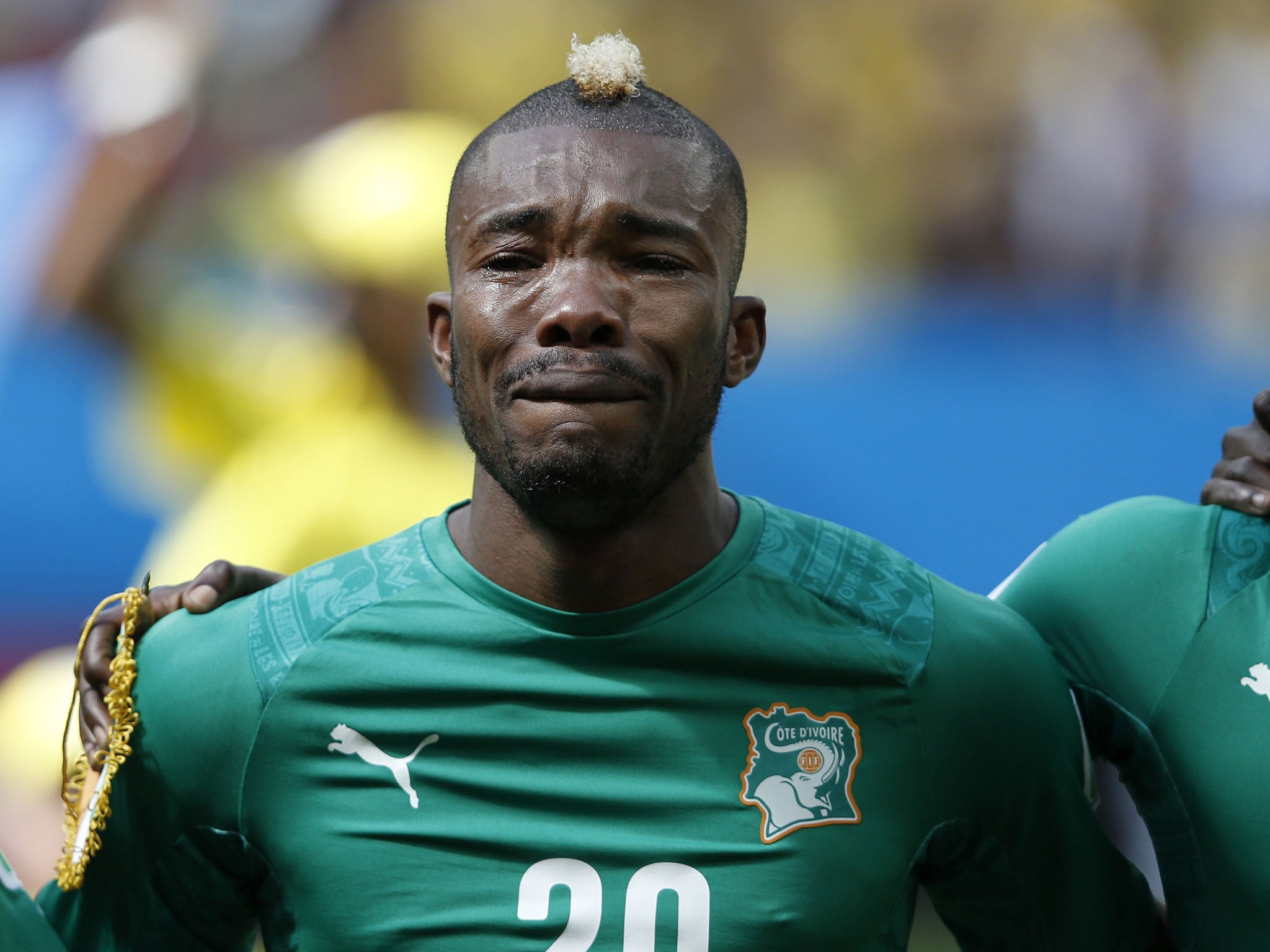 Ivory Coast player Serey Die bursts into tears during the national anthems