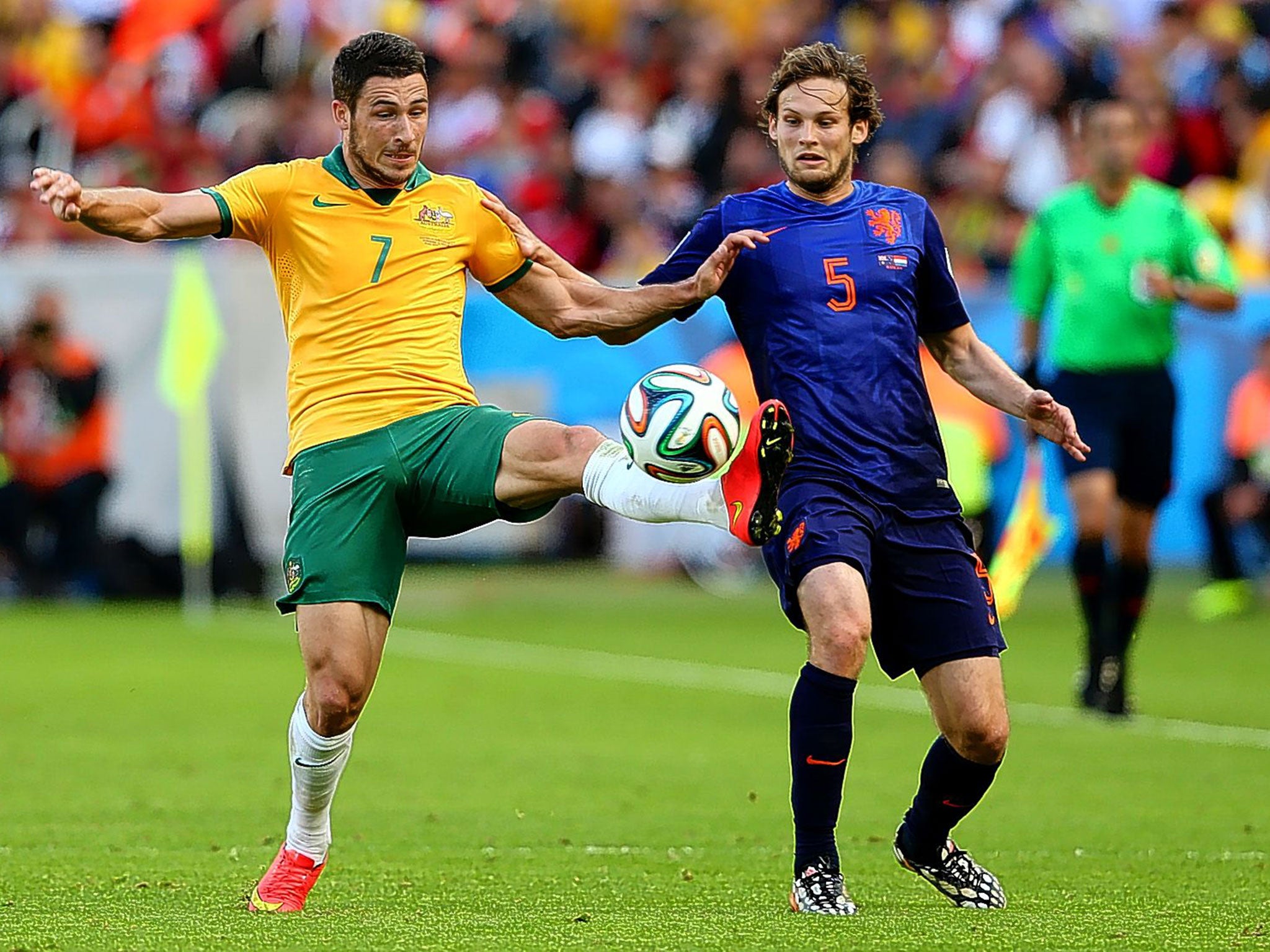 Matthew Leckie of Australia challenges Holland’s Daley Blind in their group B game. I would take a chance on bringing both to the Premier League