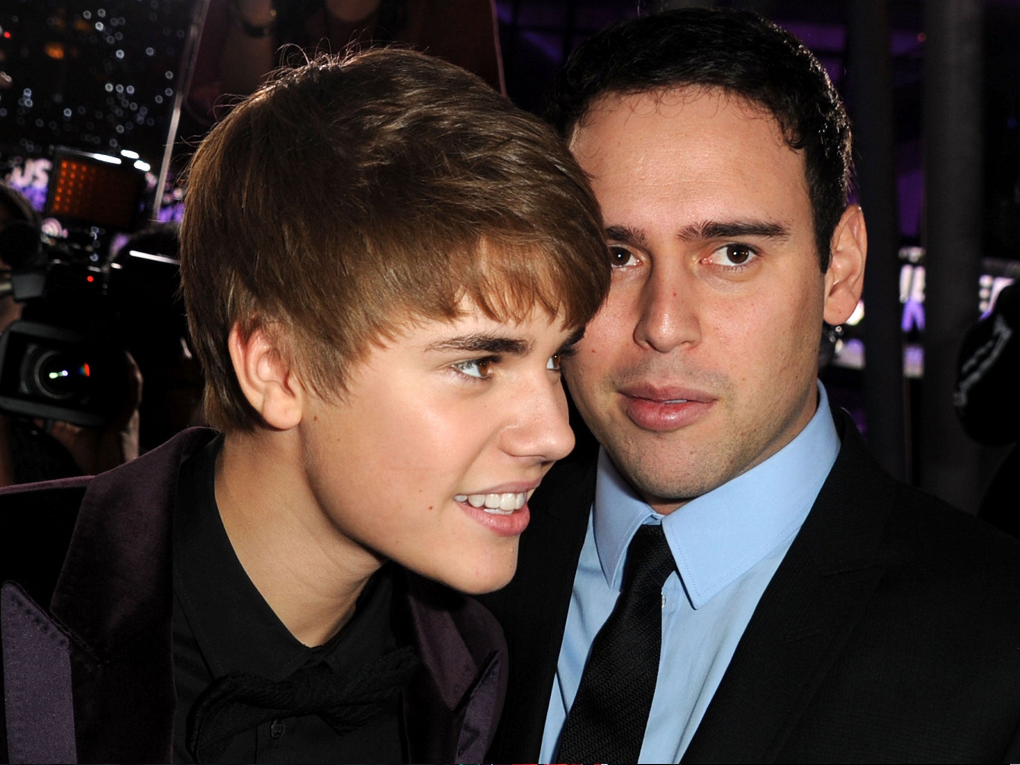 Singer Justin Bieber (L) and manager Scooter Braun arrive at the premiere of Paramount Pictures' 'Justin Bieber: Never Say Never' held at Nokia Theater L.A.