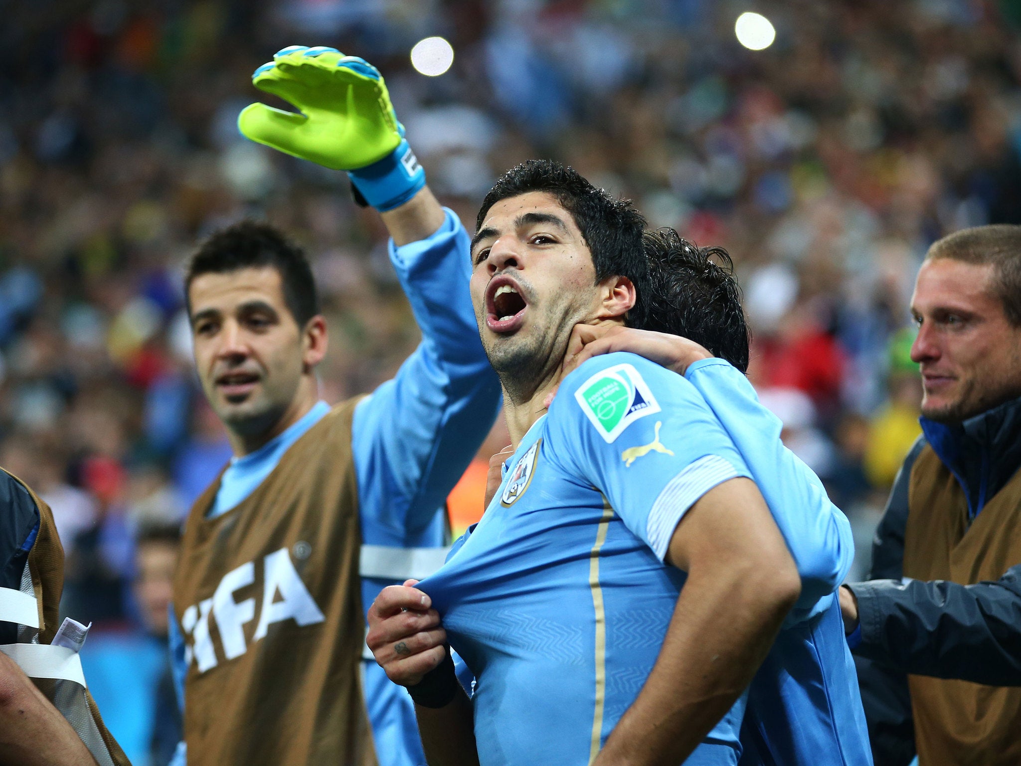 Luis Suarez of Uruguay celebrates with his teammates after scoring his team's second goal during the 2014 FIFA World Cup Brazil Group D match between Uruguay and England at Arena de Sao Paulo on June 19, 2014 in Sao Paulo, Brazil.