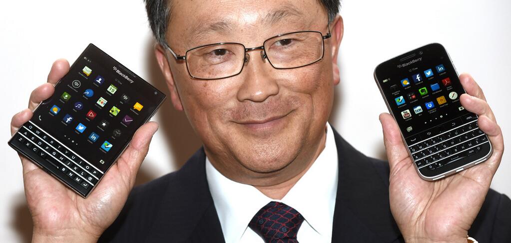 CEO John Chen holds the Passport and Classic smartphones.