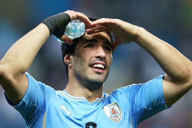 Luis Suarez looks towards the crowd during the 2-1 victory over England
