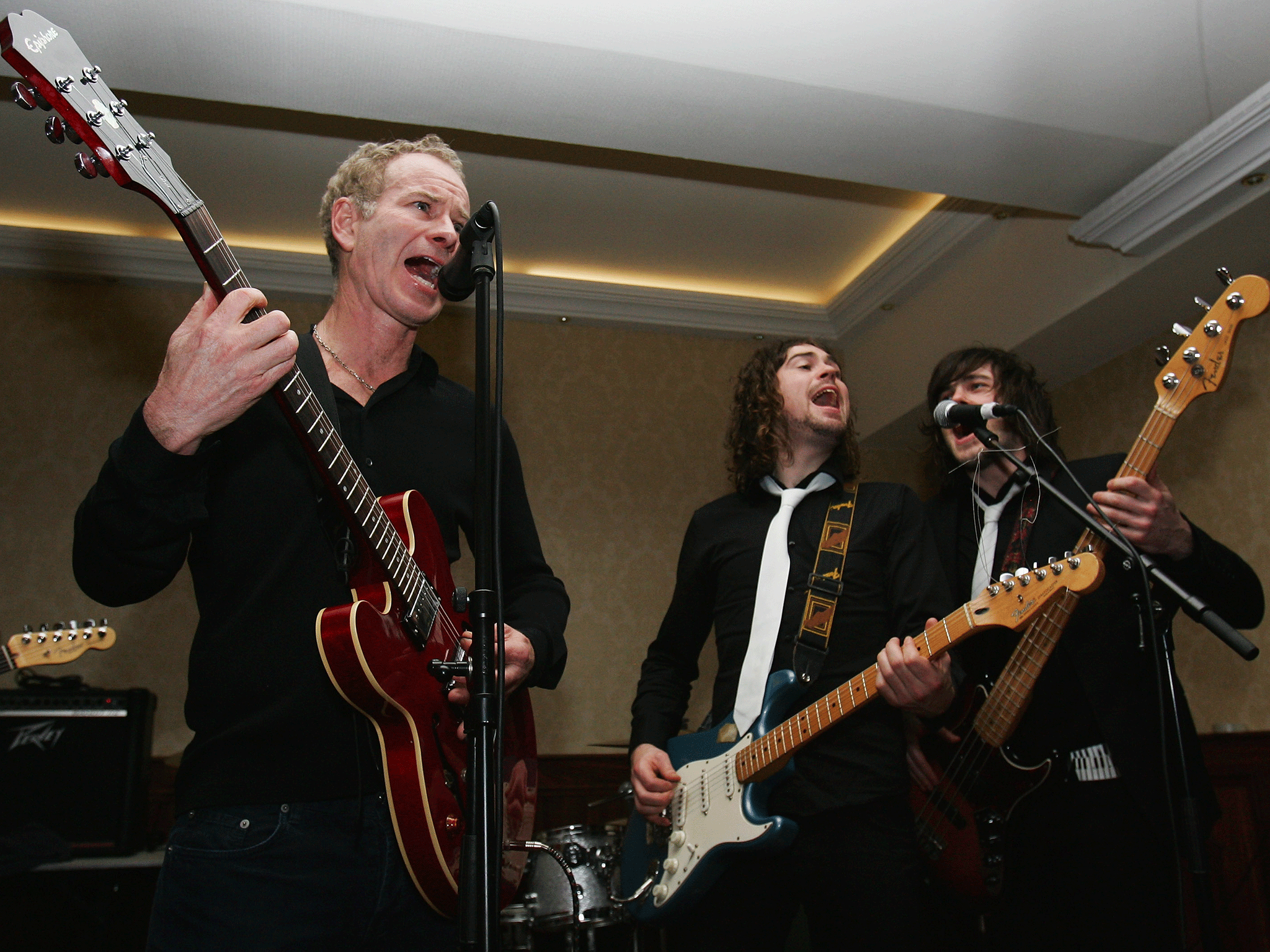 It’s a smash: John McEnroe (left) with Belfast band Ed Zealous
