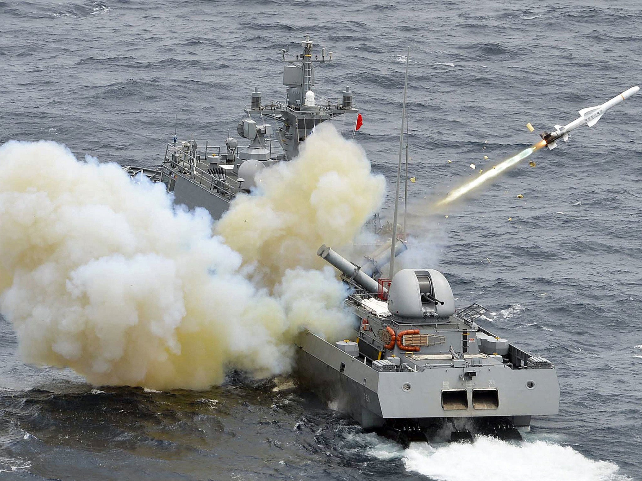 South Korean Navy's Guided Missile Patrol Gun Boat fires a harpoon missile during a live firing exercise against a possible invasion by North Korean submarines near islands called Dokdo in South Korea and Takeshima in Japan