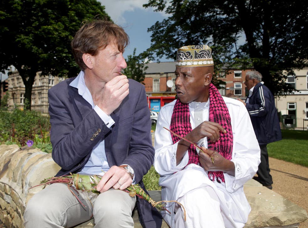 Mohamed Hasan explains to Jonathan Brown how to chew khat in a Sheffield park yesterday
