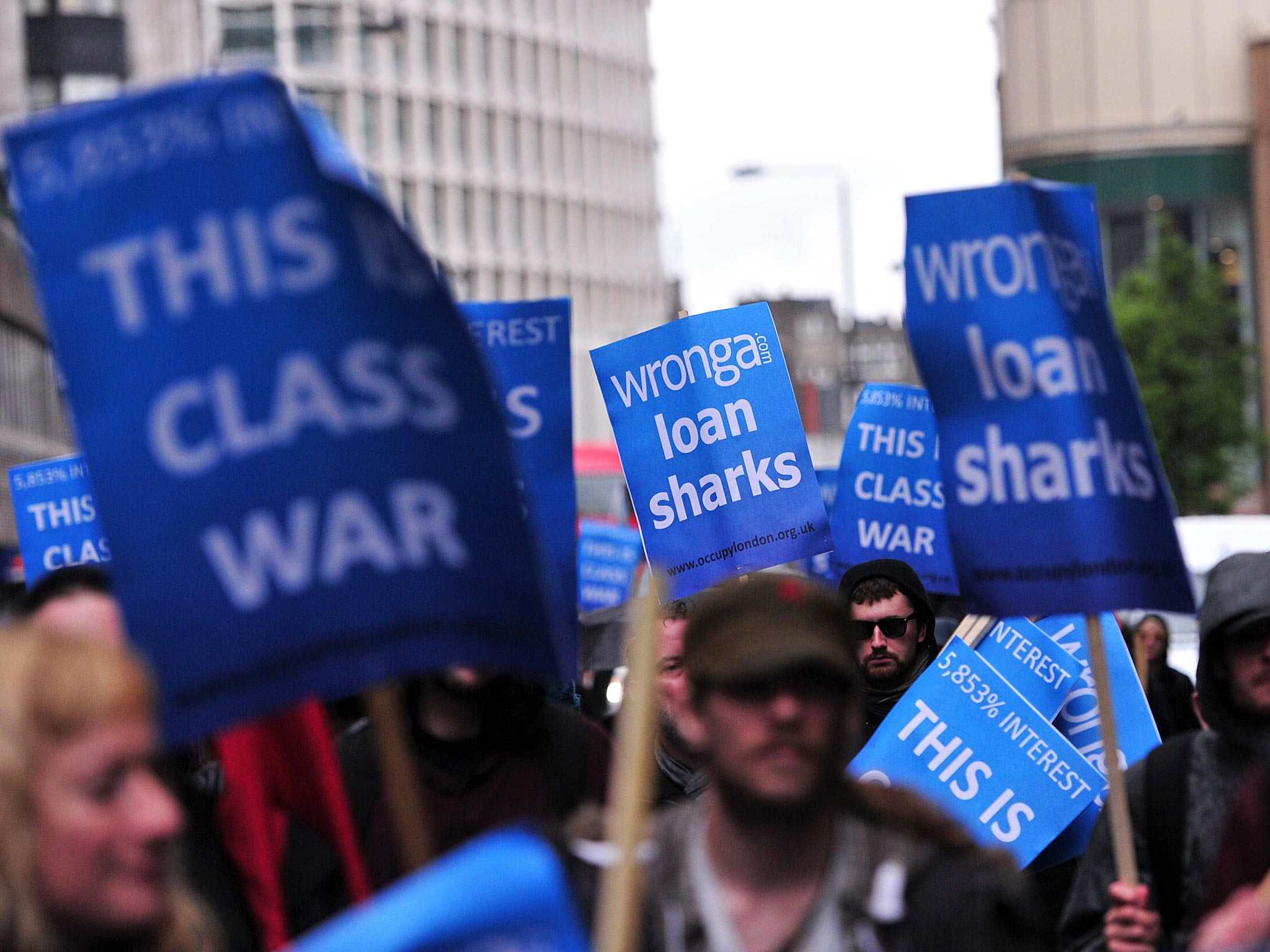 Protesters demonstrate against payday loan firms in
London in May