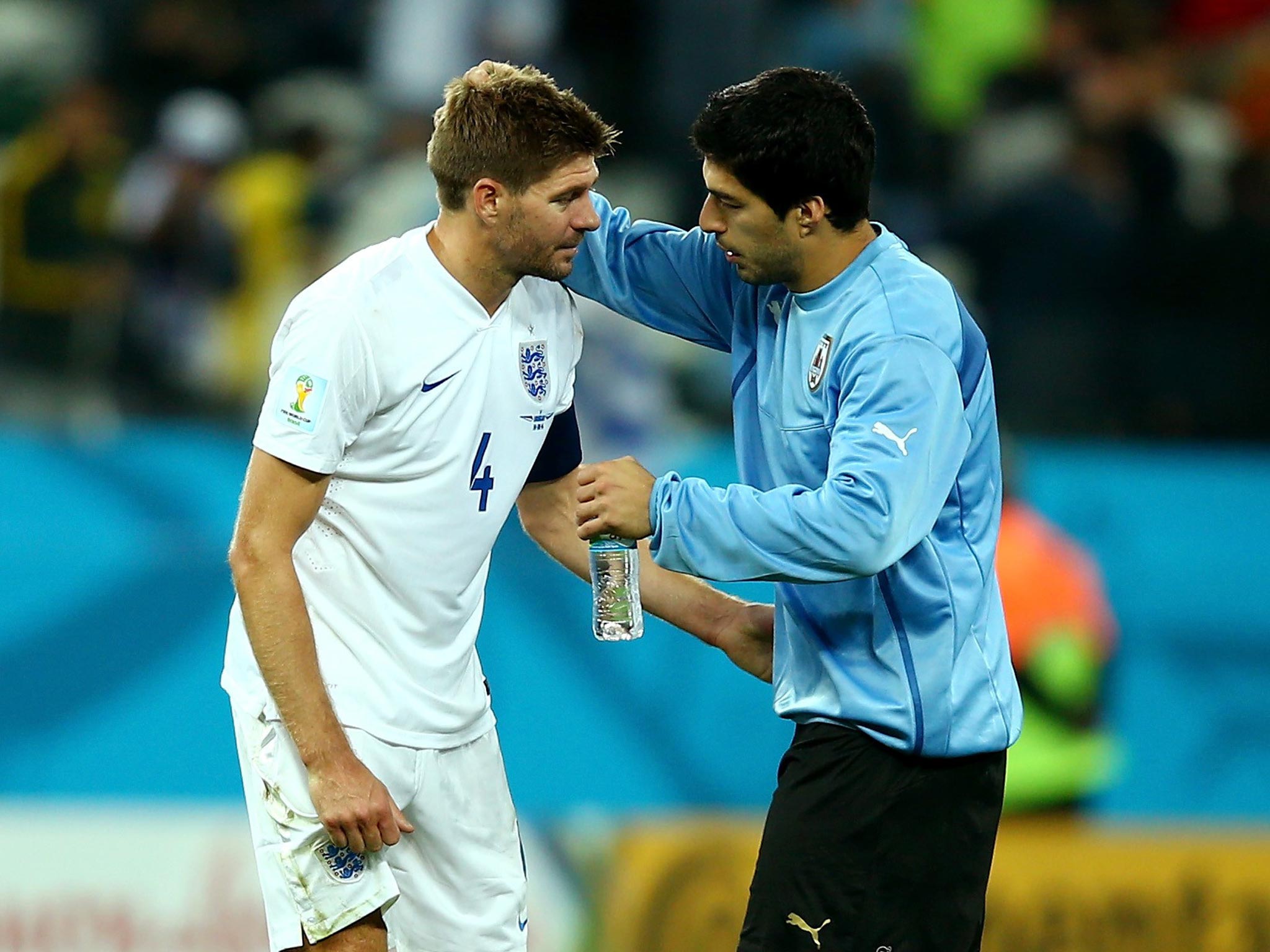 Luis Suarez consoles Steven Gerrard after England’s defeat against Uruguay