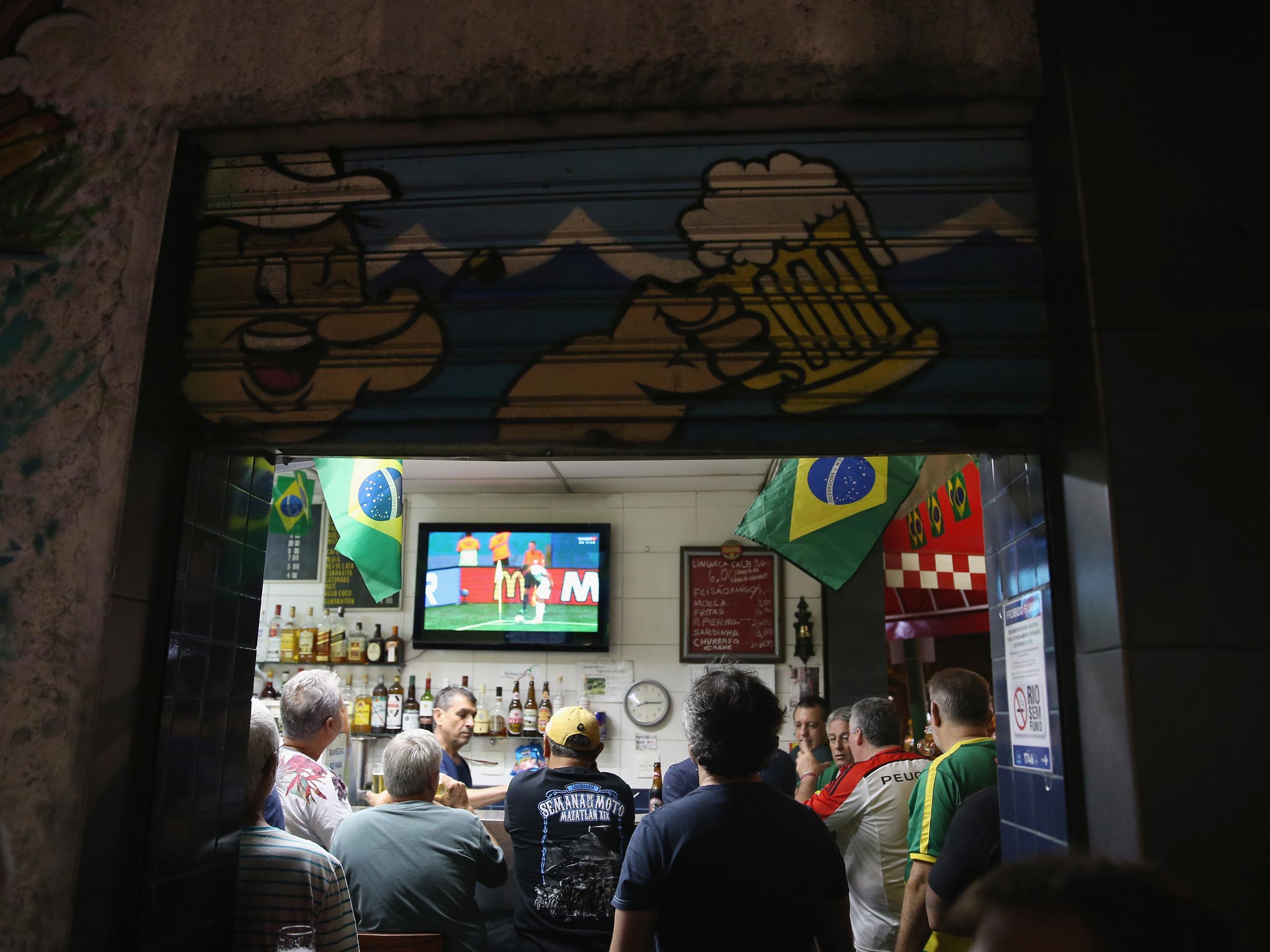 Fans watch and argue over World Cup coverage in a bar in Brazil