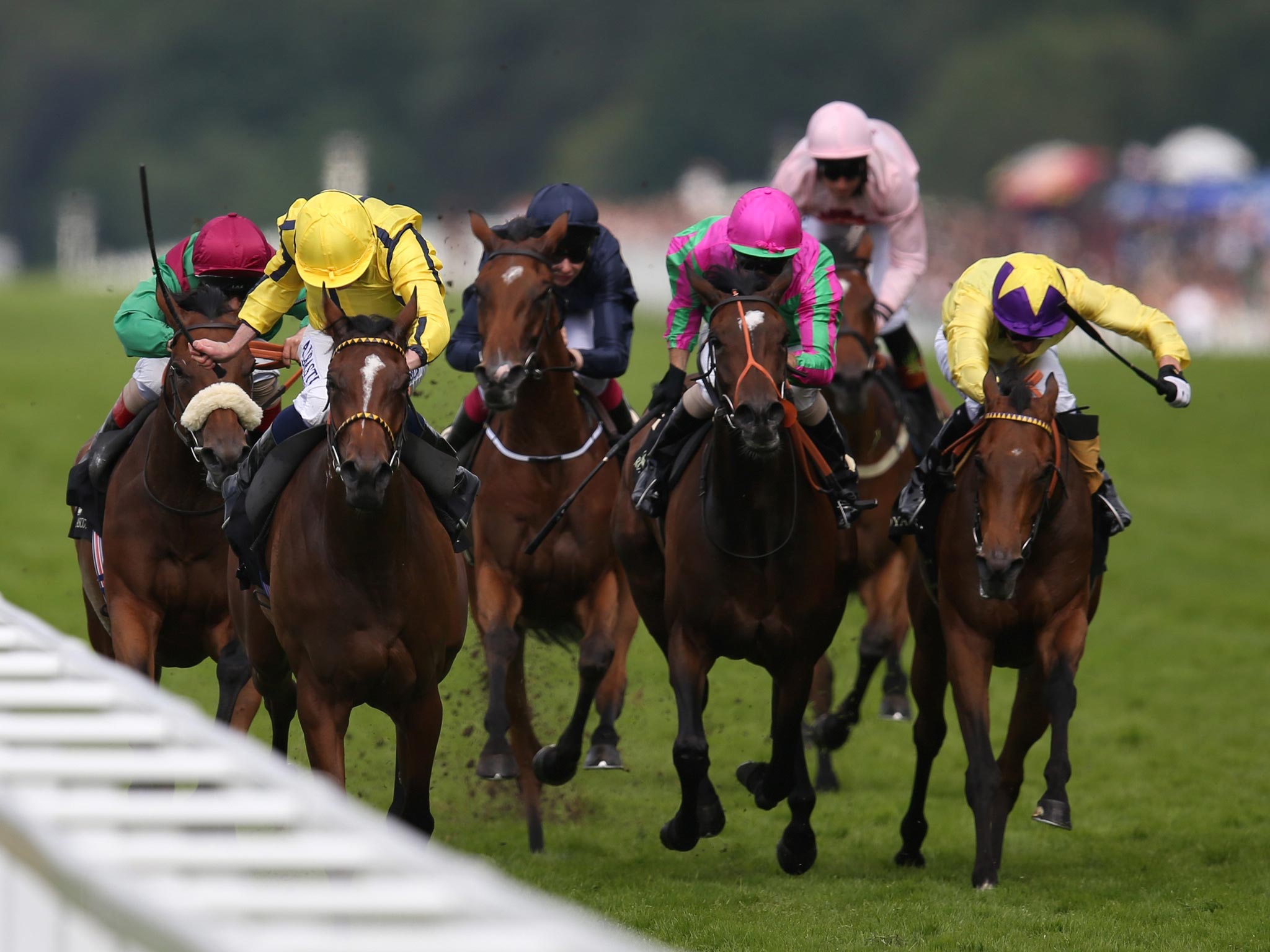 Rizeena, ridden by Ryan Moore (second left), comes up the rail to win the Coronation Stakes at Ascot yesterday