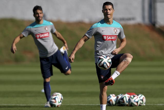 Cristiano Ronaldo during training yesterday, with his
left knee strapped up