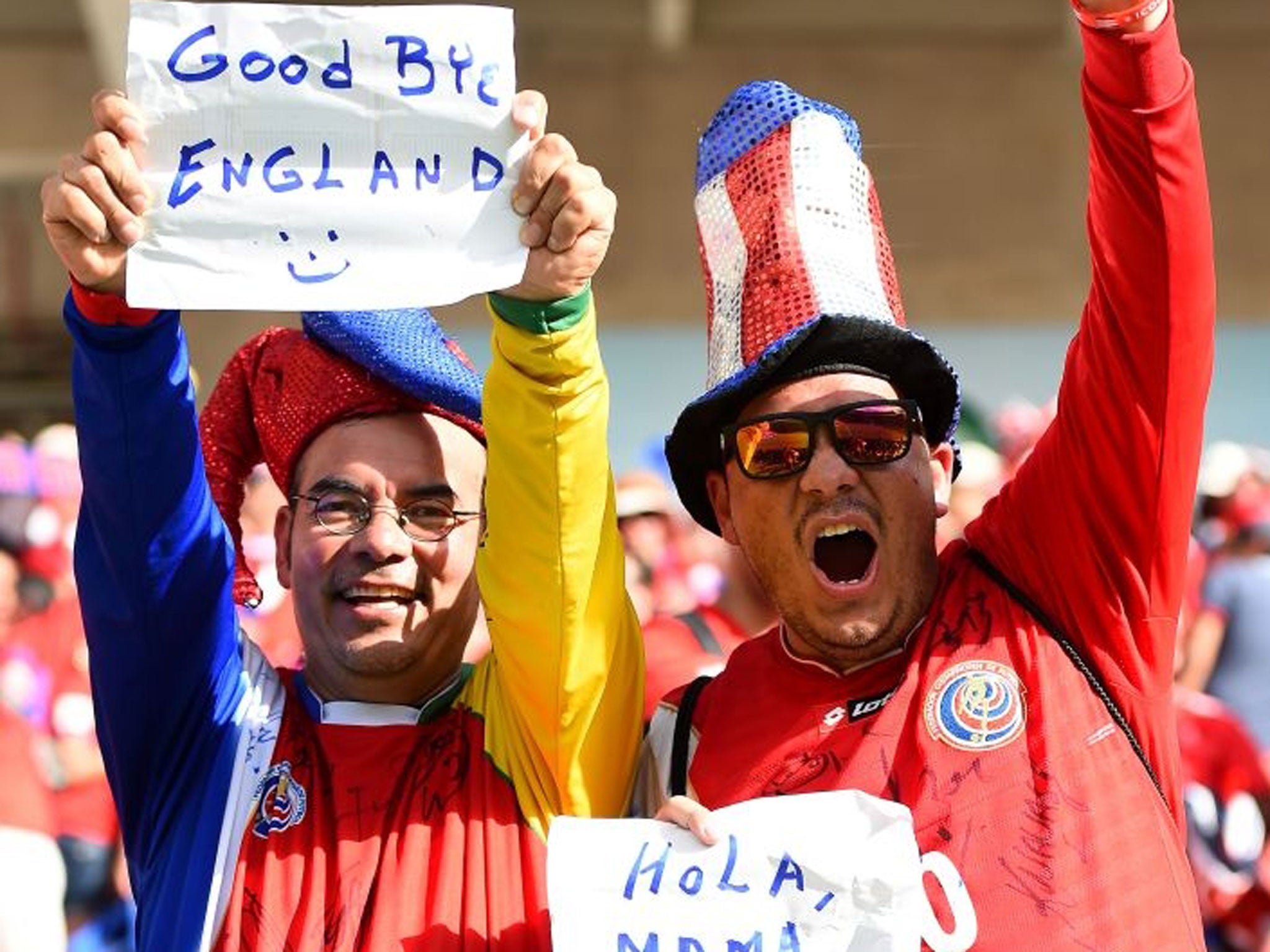 A Costa Rica fan holds up a sign reading "Good Bye England" during the 2014 FIFA World Cup Brazil Group D match between Italy and Costa Rica at Arena Pernambuco on June 20, 2014 in Recife, Brazil.