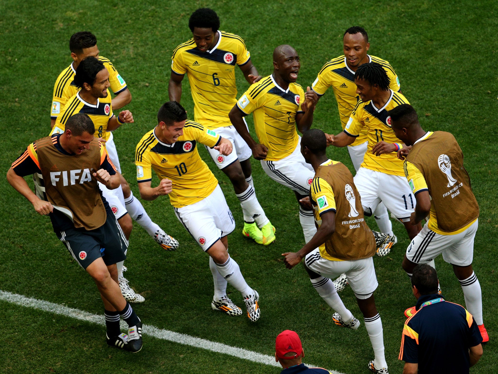 James Rodriguez celebrates scoring for Colombia