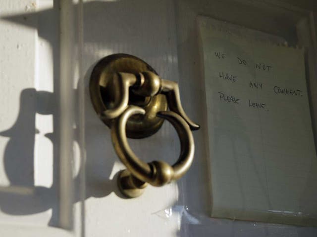 A note on his door in 2012 asks people seeking a comment to leave