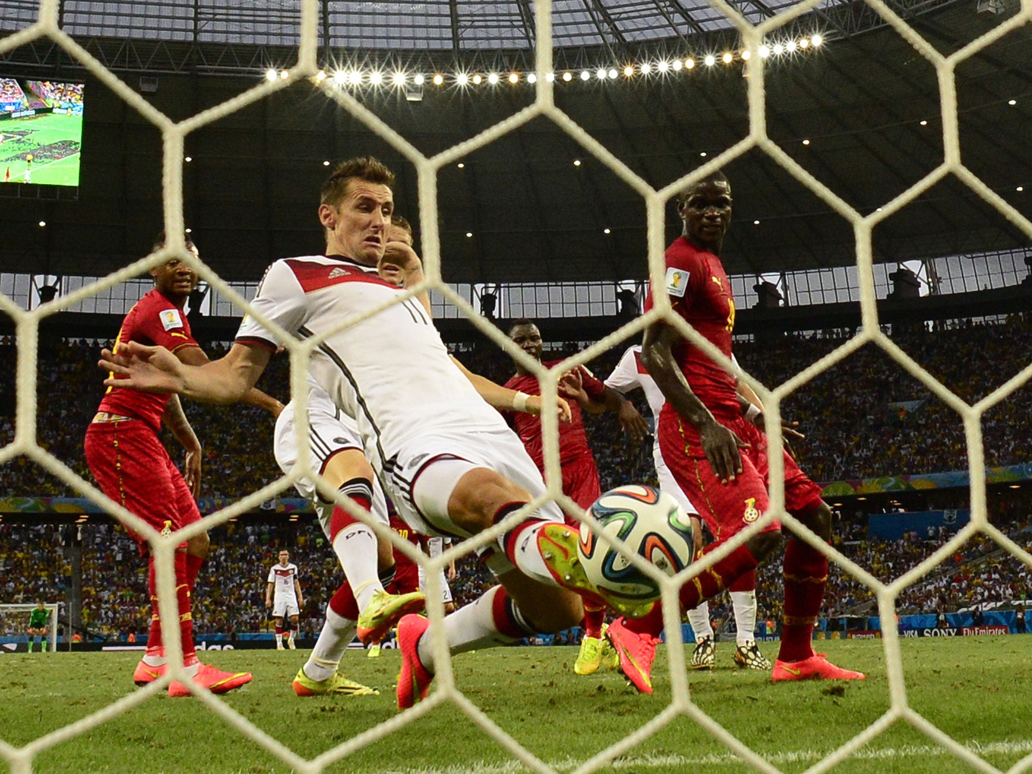 Miroslav Klose scores Germany's second goal in the 2-2 draw with Ghana