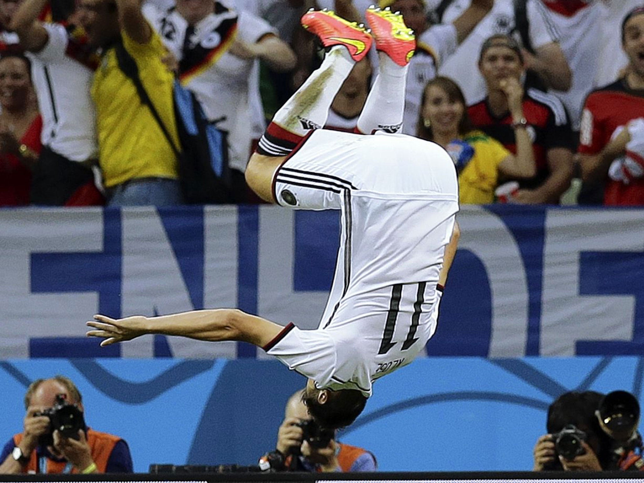 Vorsprung durch Klose: Germany’s veteran striker Miroslav Klose does a flying somersault to celebrate his equaliser