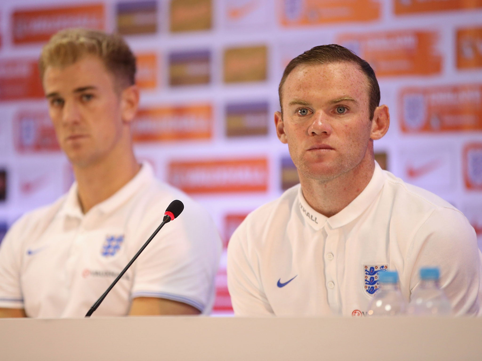 Joe Hart and Wayne Rooney face the media in a press conference after an England training session at the Urca Military Base on June 21, 2014 in Rio de Janeiro, Brazil