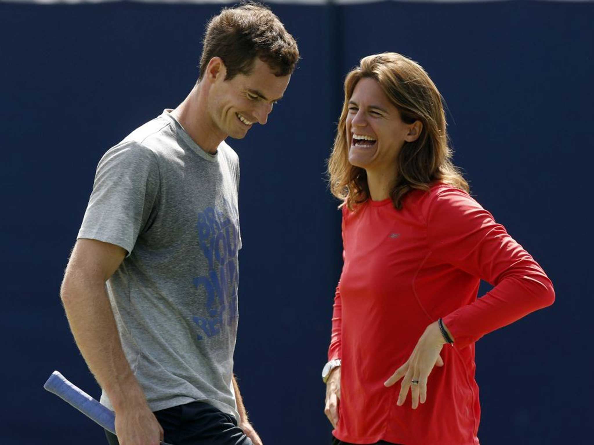 Happy couple: Andy Murray and Amélie Mauresmo share a joke during training, highlighting the relaxed nature of their new relationship