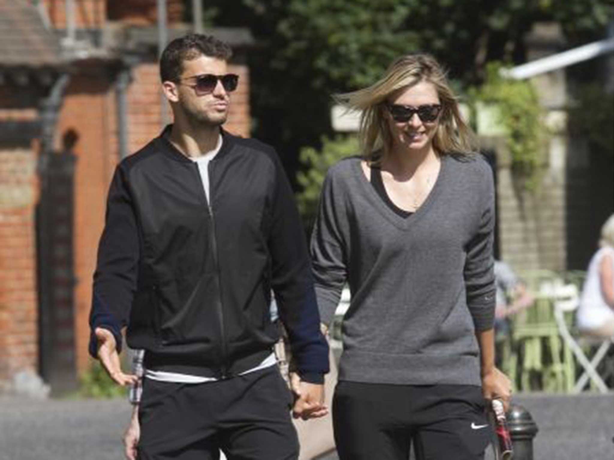 Hands on: Dimitrov and Sharapova have dated for the past 18 months