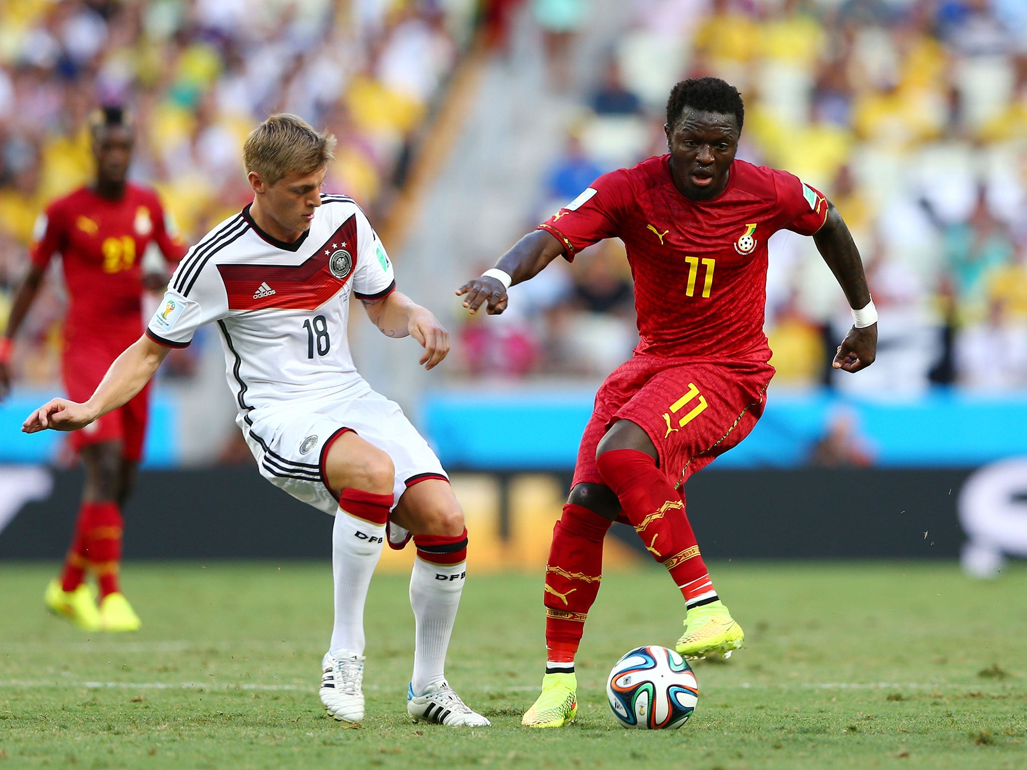 Ghana midfielder Sulley Muntari handed out cash to children in the Brazilian city of Maceio