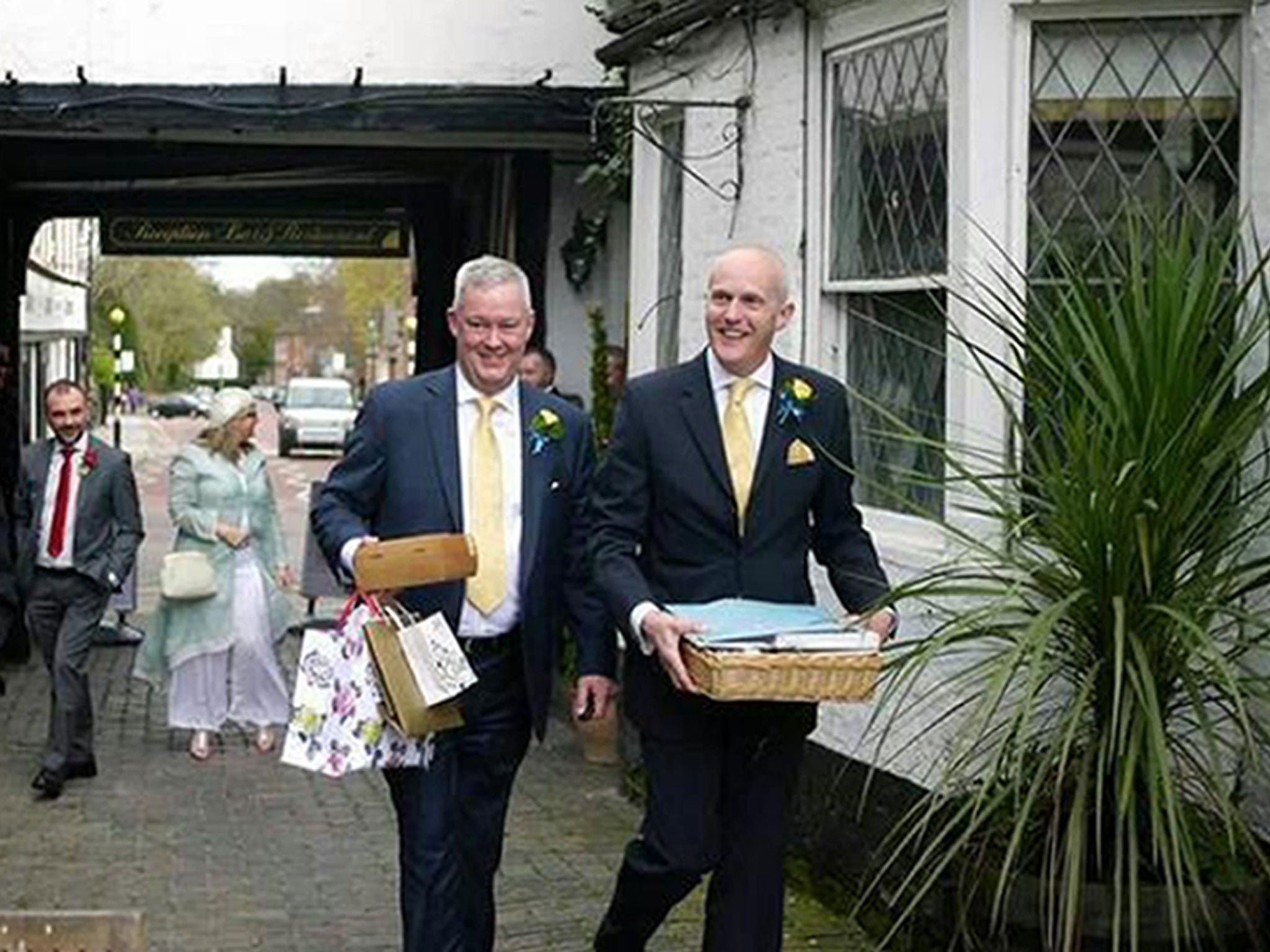 Canon Jeremy Pemberton, left, with Laurence Cunnington, right, after their marriage in April 2014