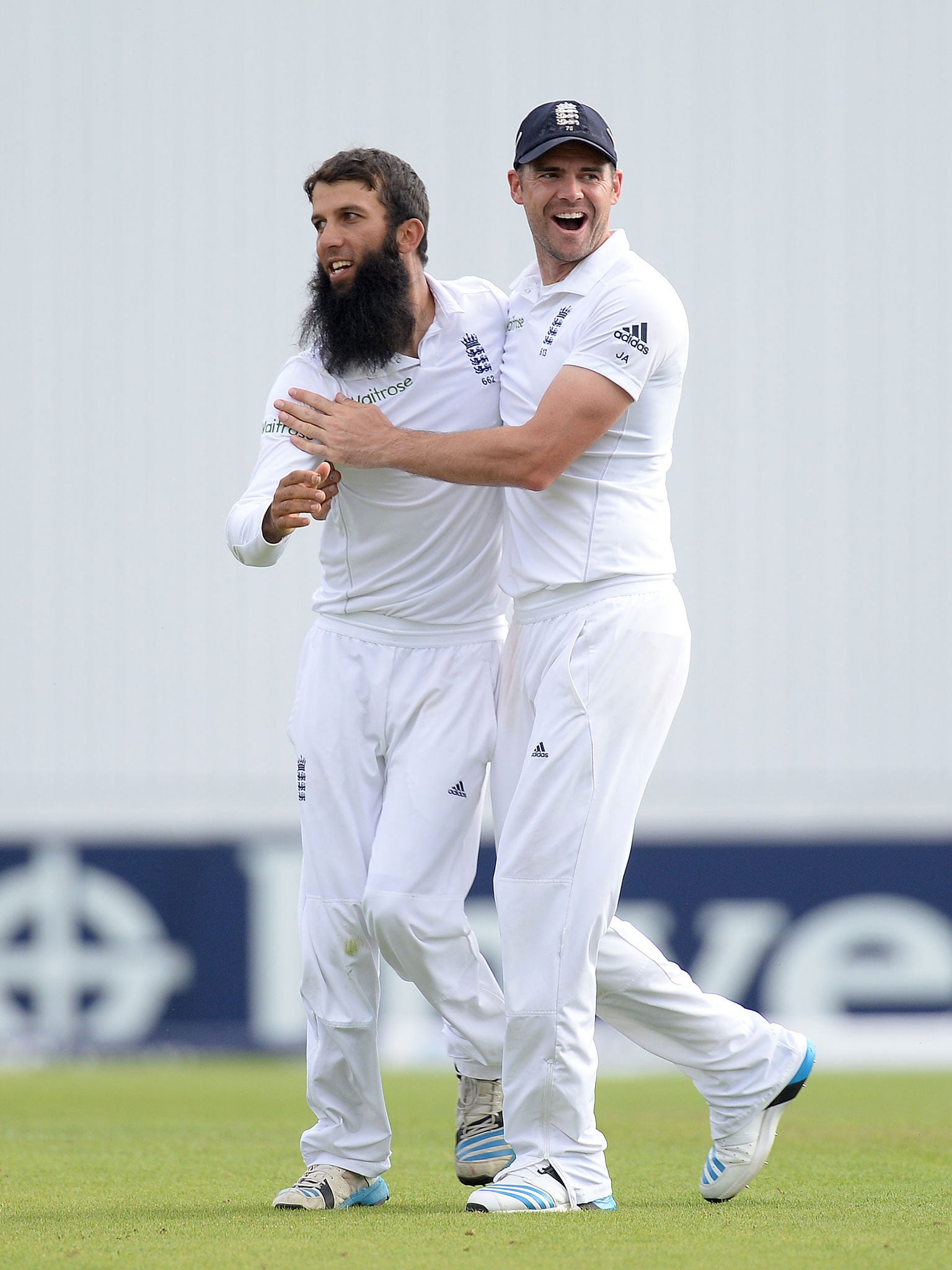 Moeen Ali, left, celebrates with James Anderson after taking the wicket of Sri Lanka’s Lahiru Thirimanne