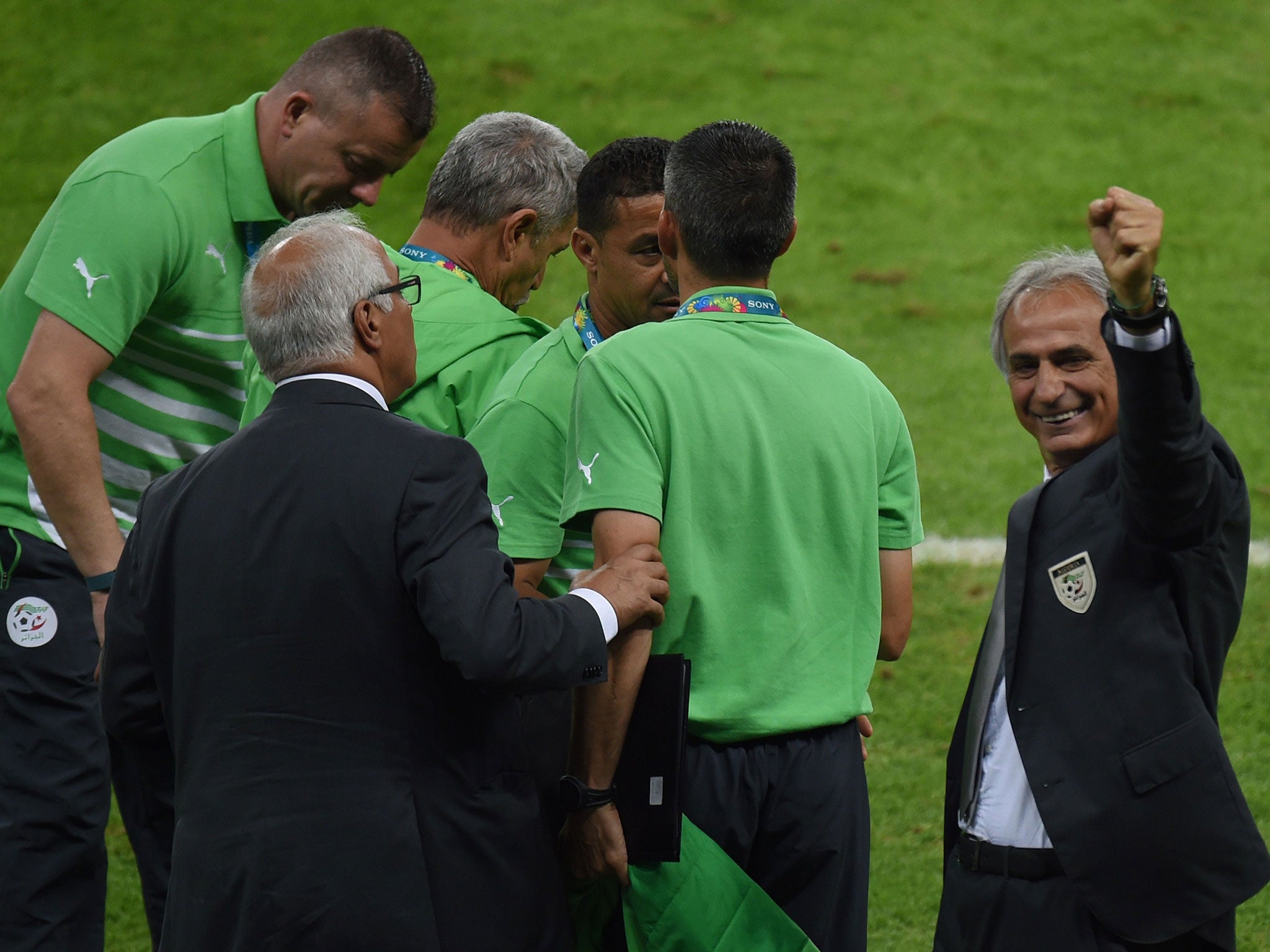 Algeria coach Vahid Halilhodzic punches the air in delight after Algeria beat South Korea 4-2