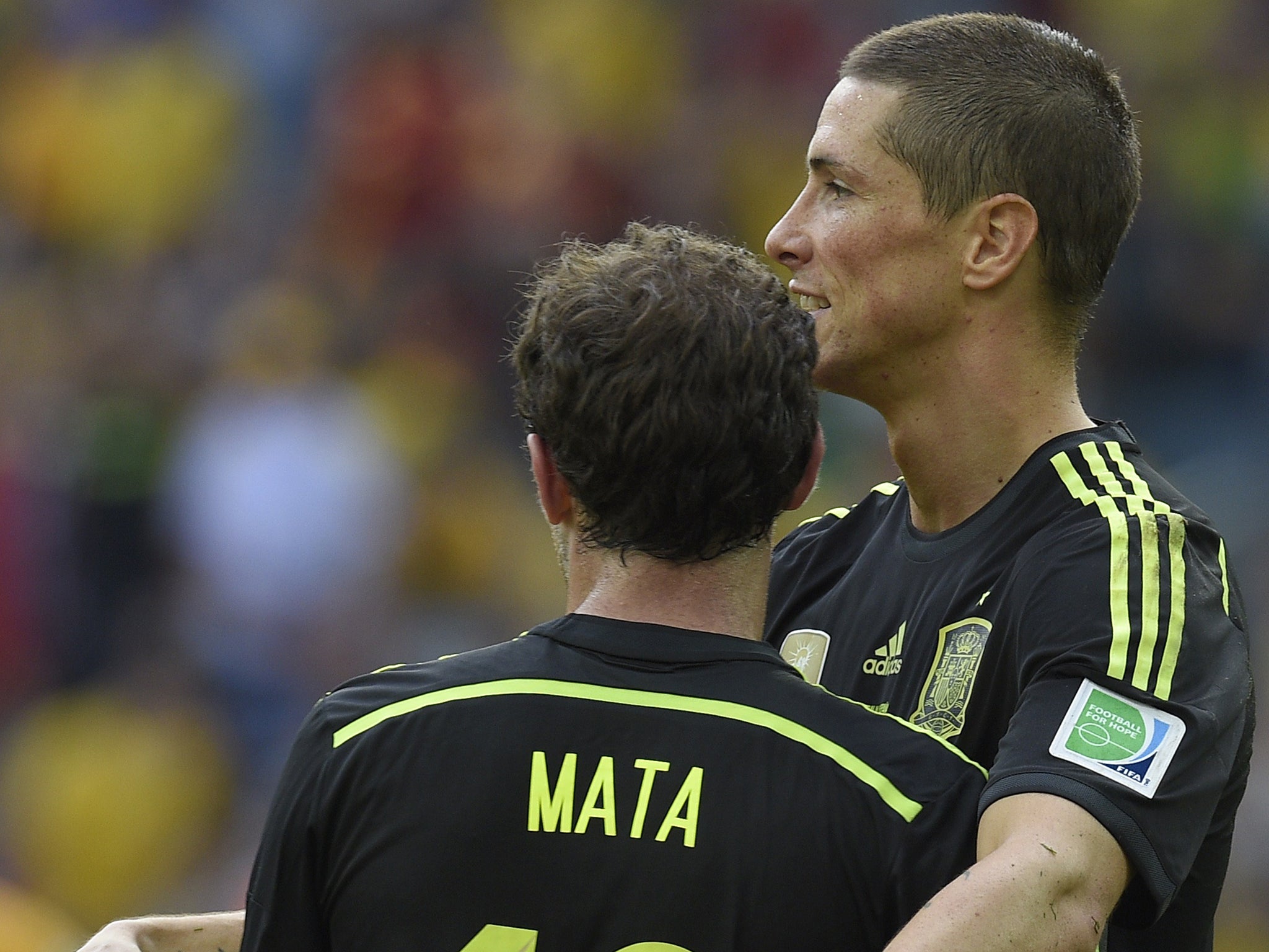 Torres and Mata celebrate during Spain's win over Australia